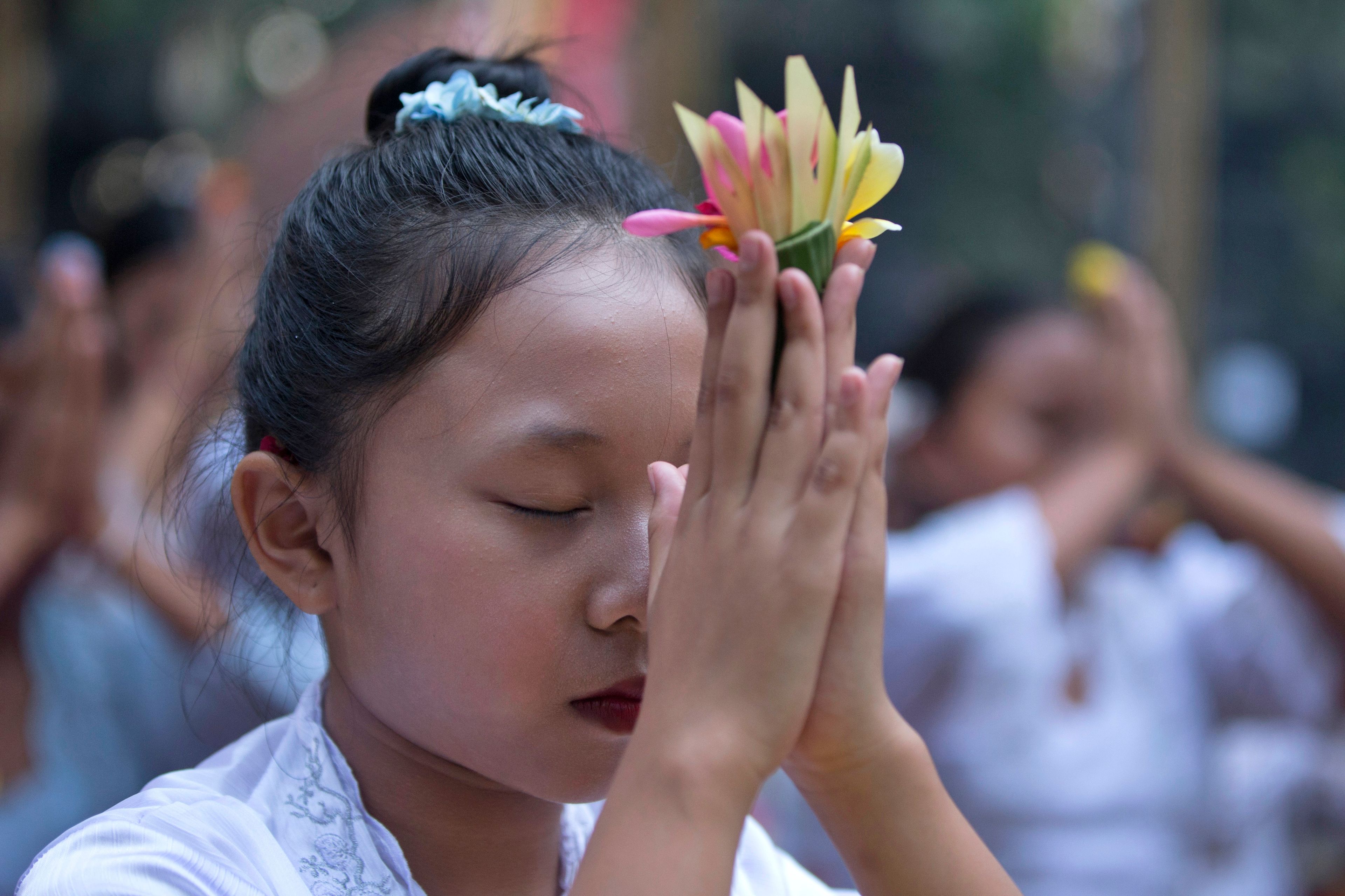 In Bali, young girls dance in a traditional Hindu festival threatened by changing times