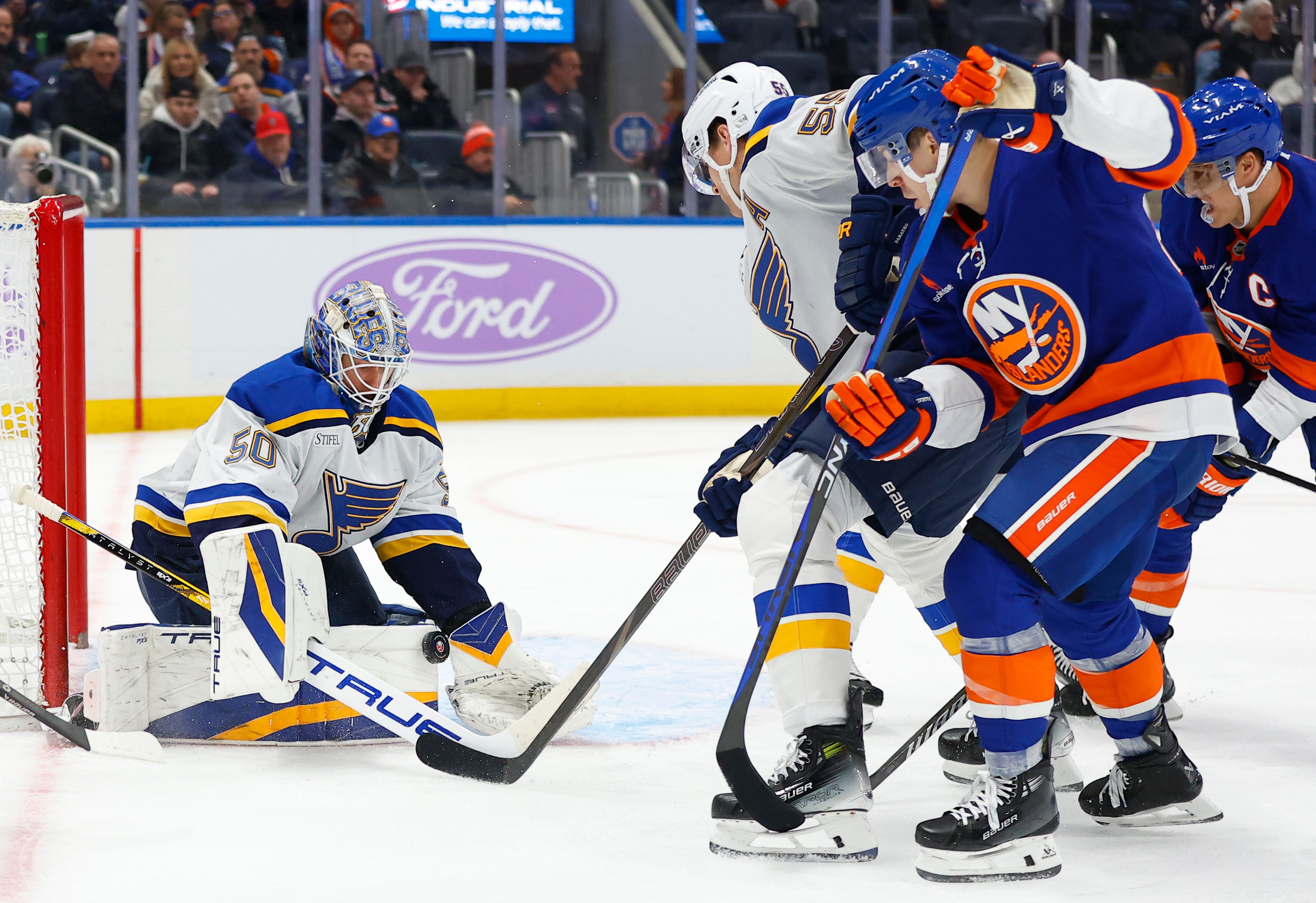 St. Louis Blues goaltender Jordan Binnington (50) makes a save against the New York Islanders during the second period of an NHL hockey game, Saturday, Nov. 23, 2024, in New York. (AP Photo/Noah K. Murray)