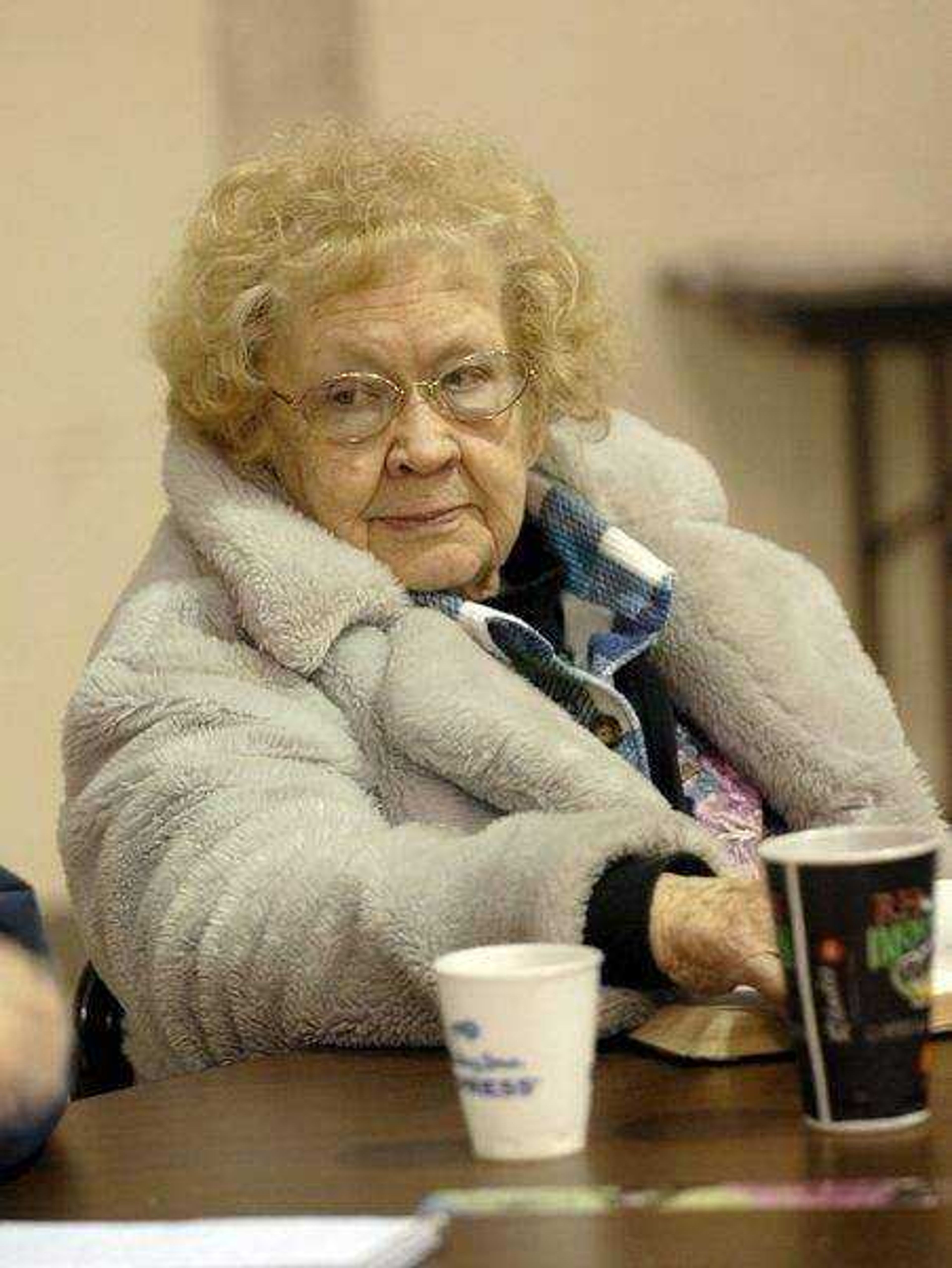 ELIZABETH DODD ~ edodd@semissourian.com<br>Mert Patterson of Cape Girardeau stays warm Wednesday morning at the Salvation Army after she lost power Tuesday night.