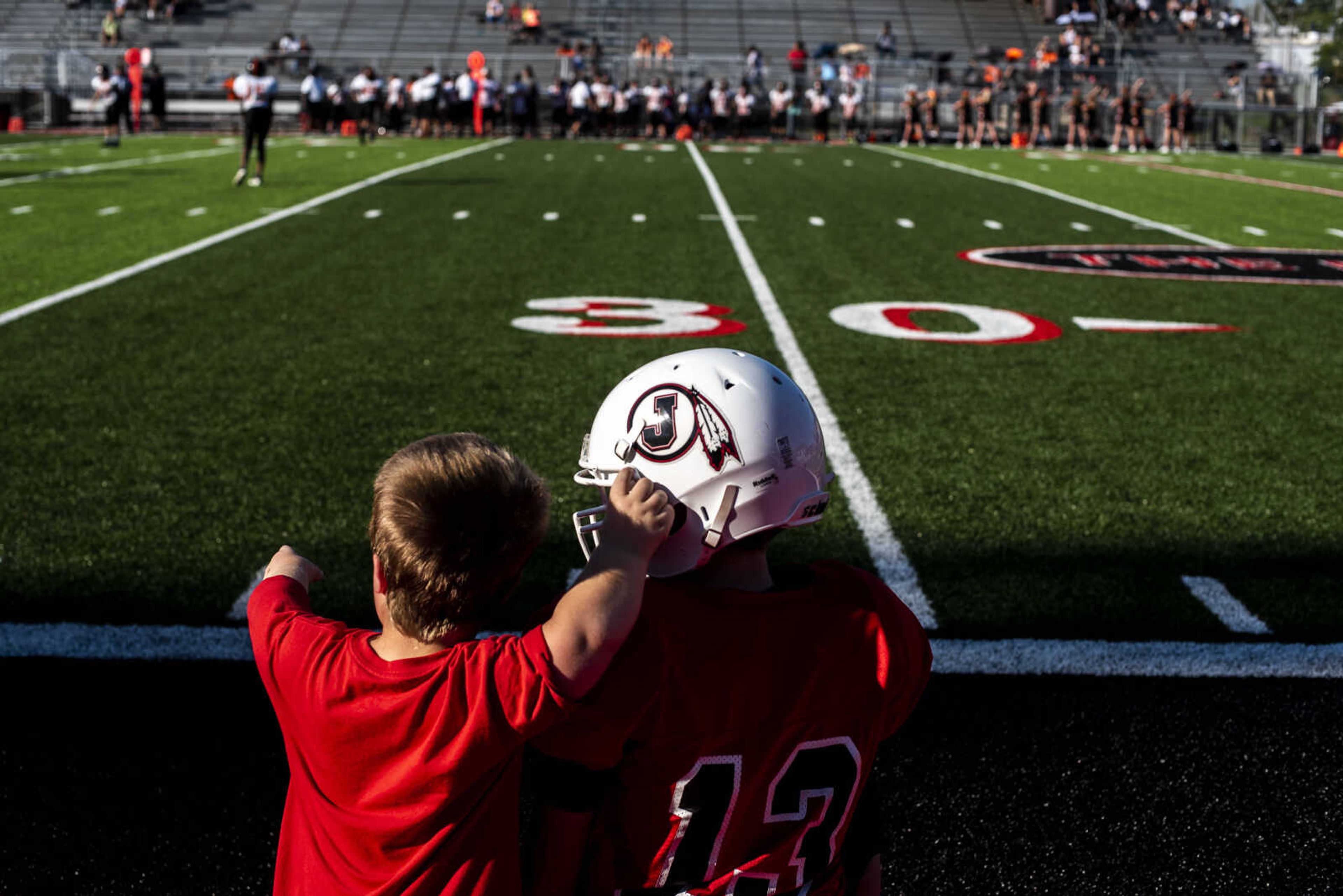 Izaac Pursley talks with a Jackson Junior High football player during a game against Cape Central September 13, 2018, in Jackson.