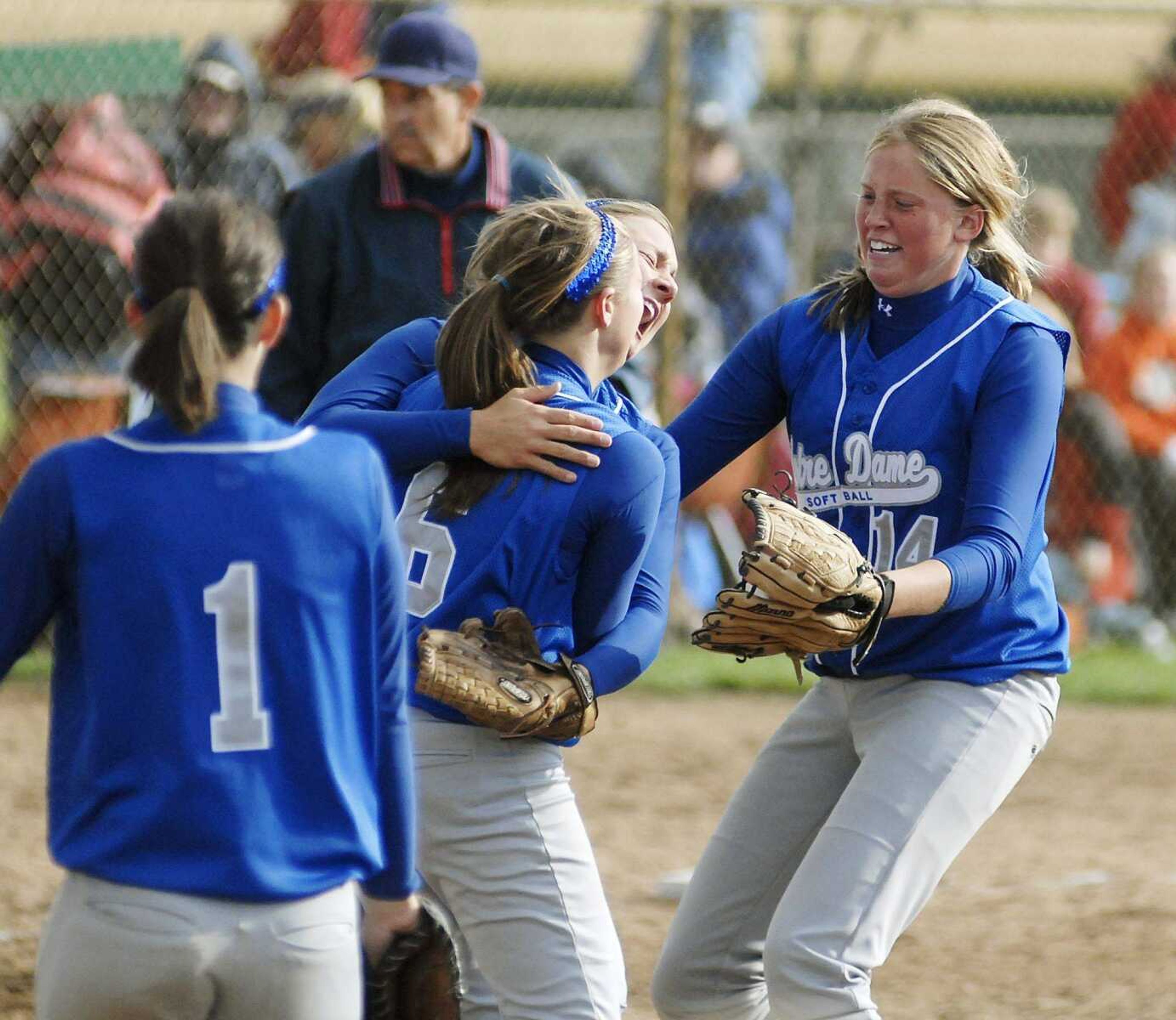 CHUCK WU ~ cwu@semissourian.com
Notre Dame's Lauren Reinagel, Brooke Glastetter and Jane Morrill celebrate after the Bulldogs defeated Kirksville 3-2 in 13 innings Friday in the Class 3 semifinals in St. Joseph.