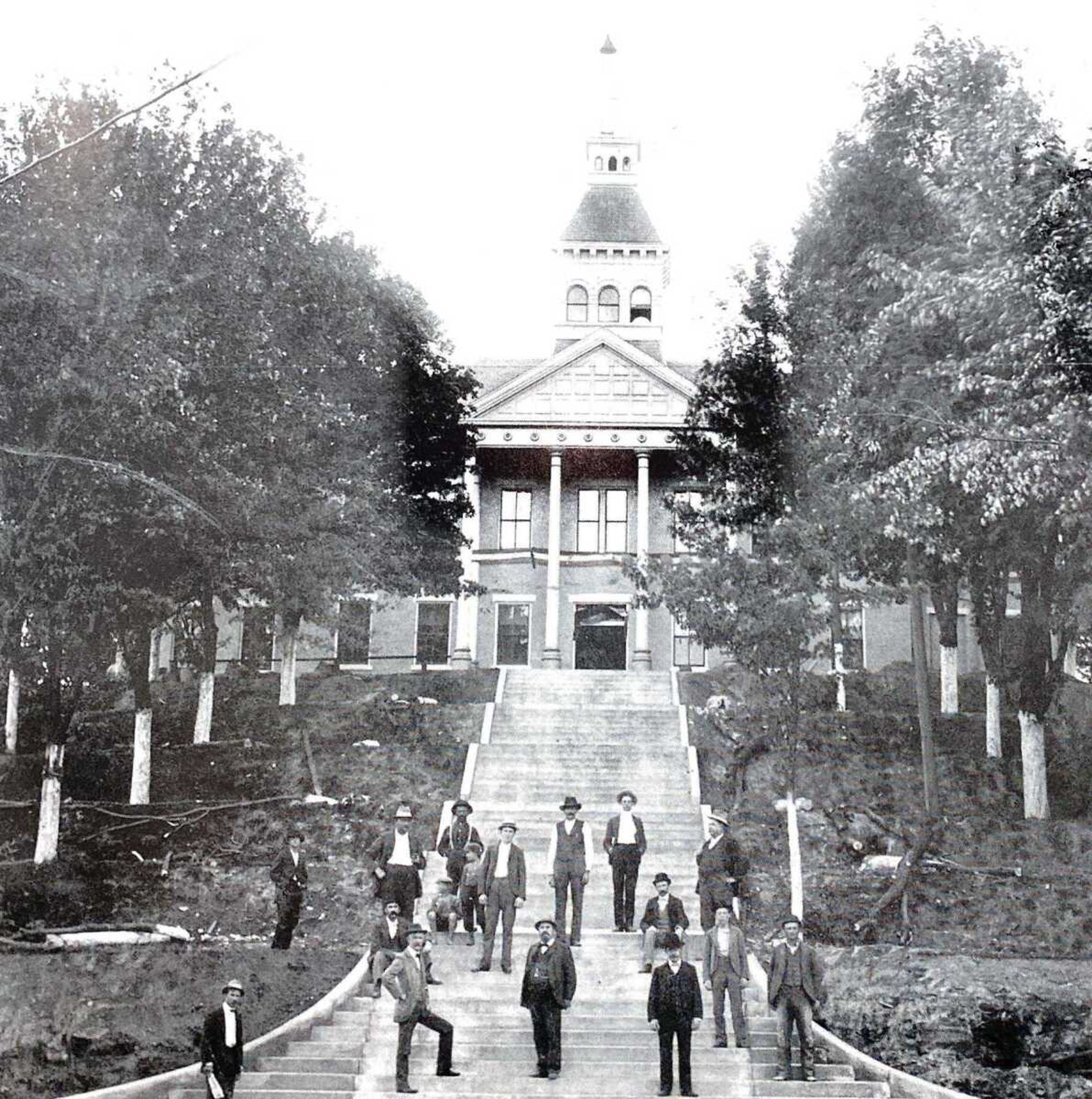 Prominent men from the Cape Girardeau community stand on the steps leading to the 1854-constructed former Common Pleas Courthouse, circa 1900. The photo was taken not long after concrete was newly poured.