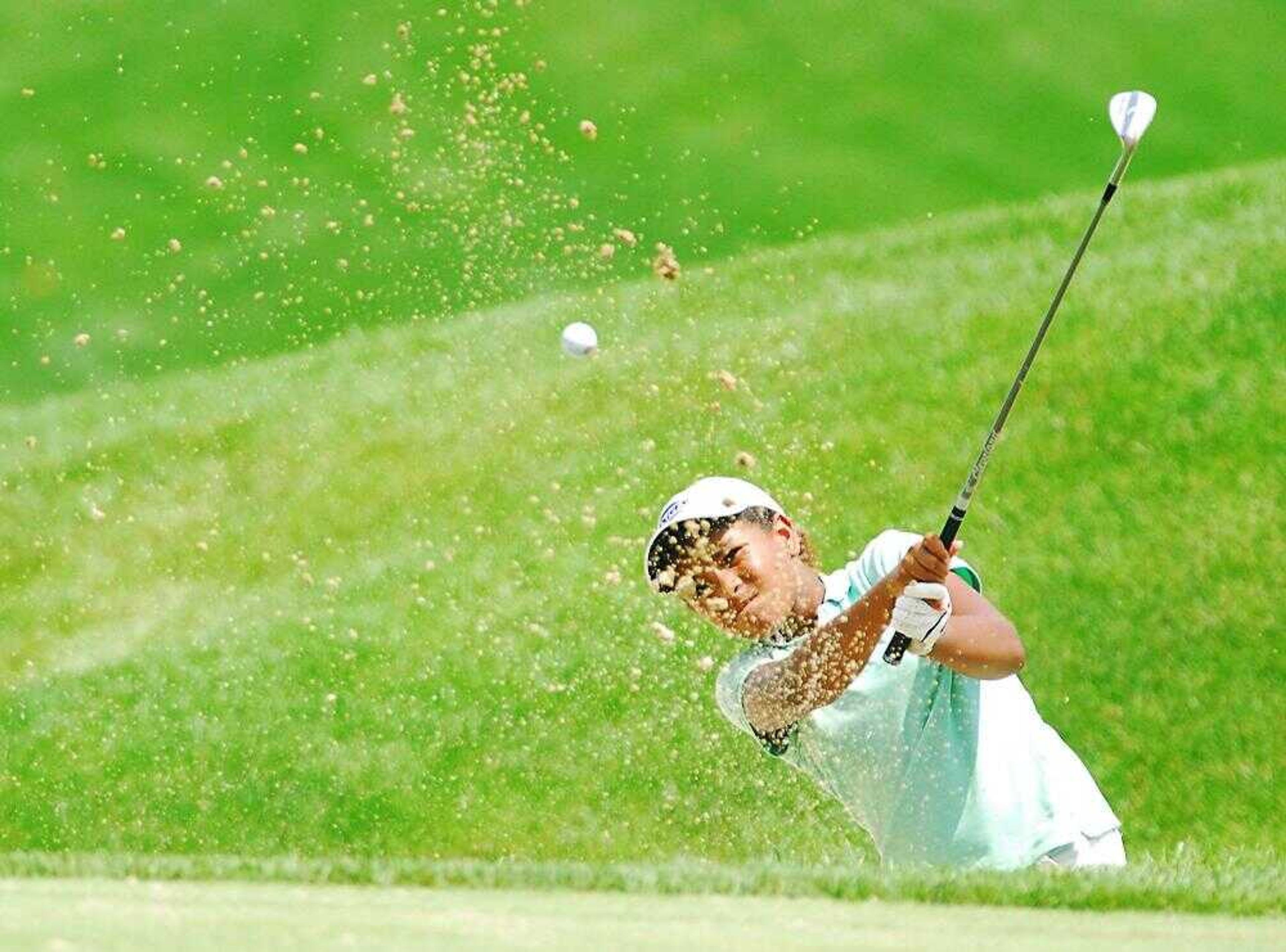 Ginger Howard knocked her ball out of the sand and onto the green during the AJGA tournament at Dalhousie Golf Club. (AARON EISENHAUER ~aeisenhauer@semissourian.com)