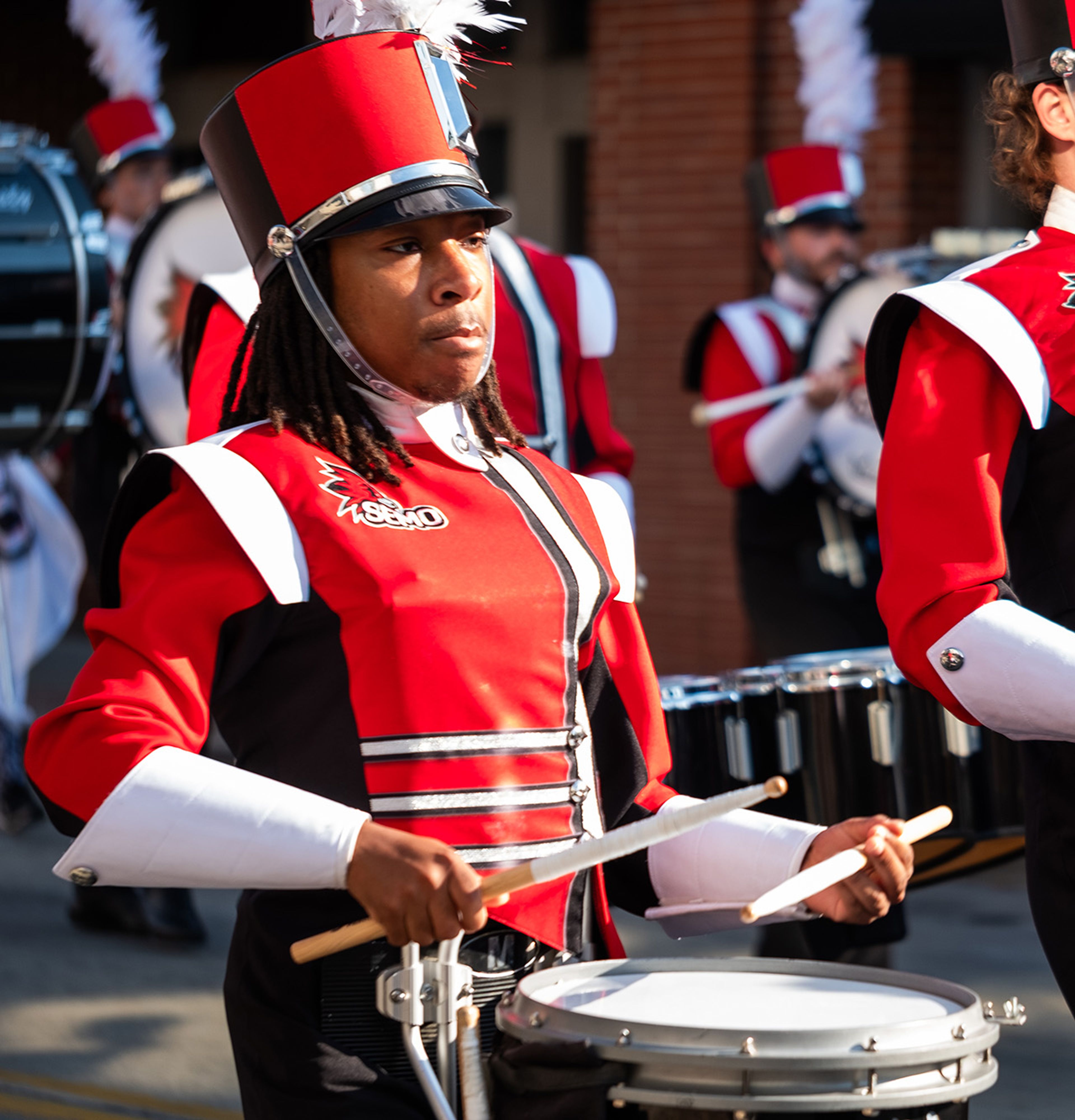 A SEMO drummer maintains focus as he plays in the parade.
