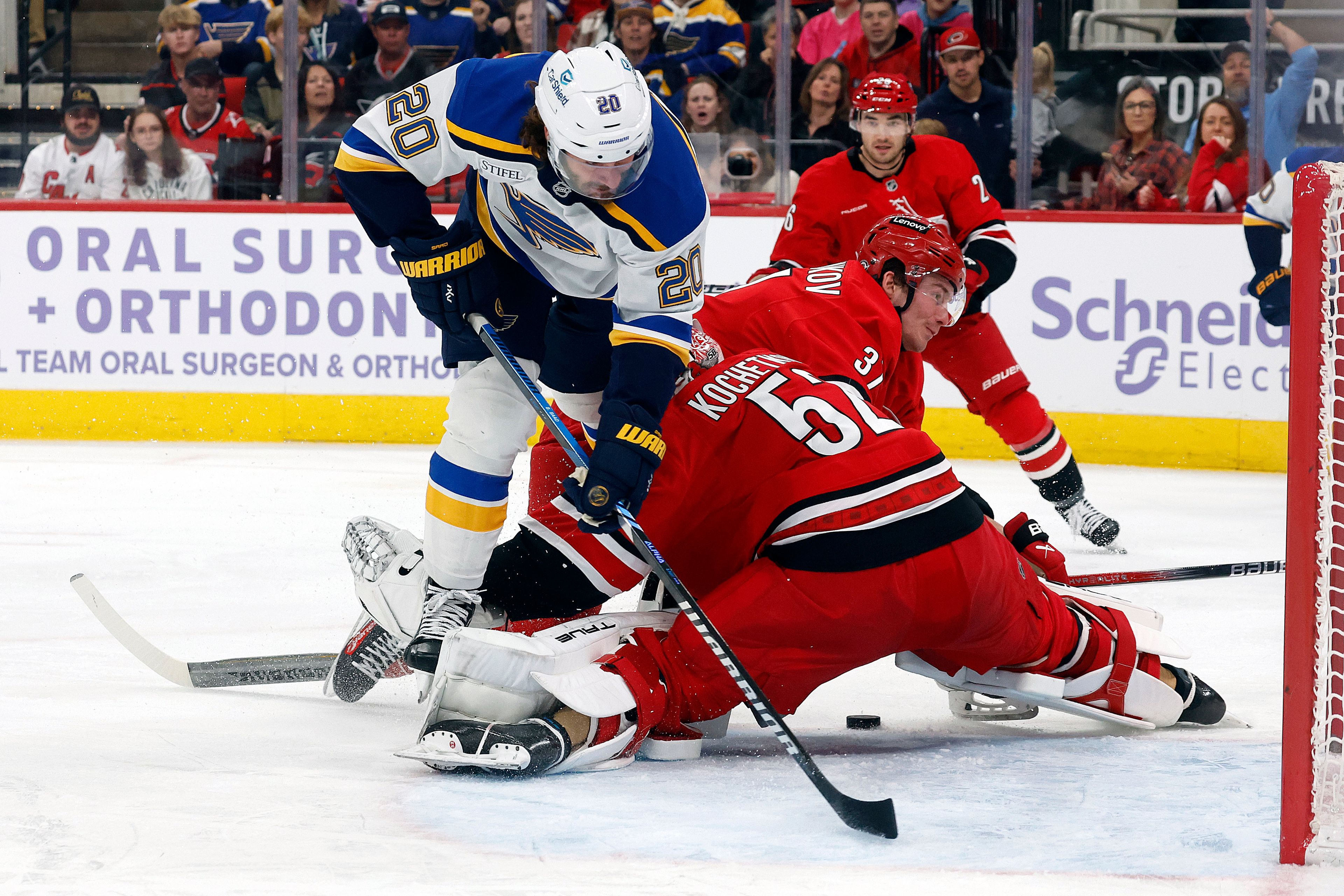 St. Louis Blues' Brandon Saad (20) tries to carry the puck through Carolina Hurricanes goaltender Pyotr Kochetkov (52) during the first period of an NHL hockey game in Raleigh, N.C., Sunday, Nov. 17, 2024. (AP Photo/Karl B DeBlaker)