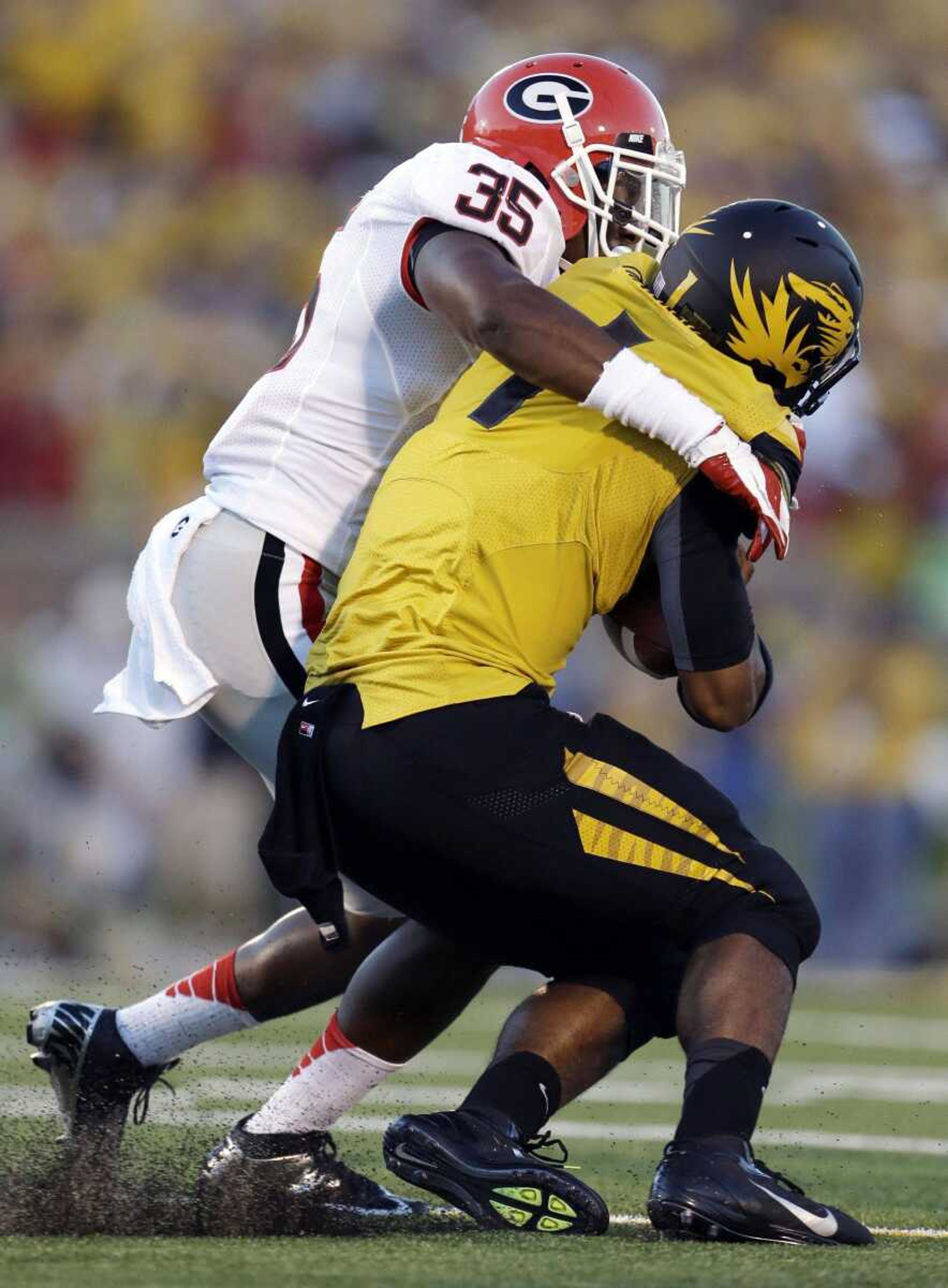 Missouri quarterback James Franklin is pulled down after a short gain by Georgia linebacker Michael Gilliard during the first quarter Saturday in Columbia, Mo. (Jeff Roberson ~ Associated Press)