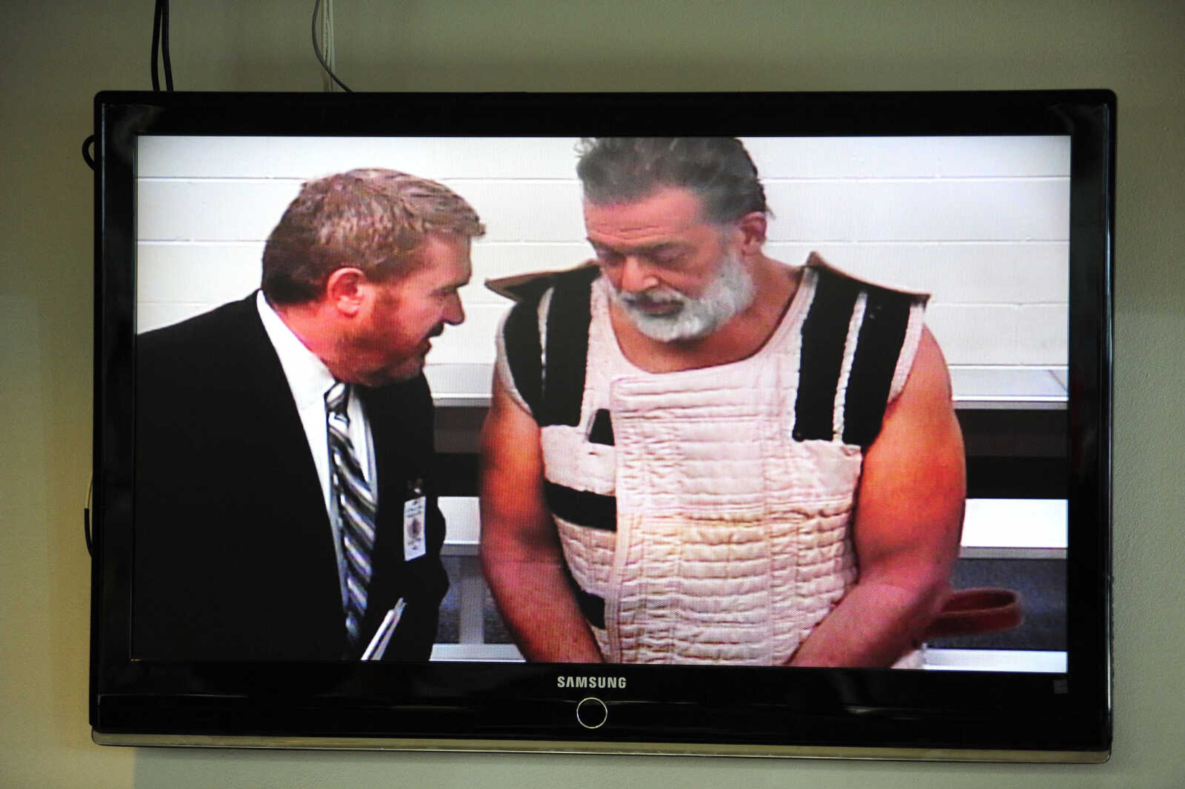 Shooting suspect, Robert Dear, right, appears via video before Judge Gilbert Martinez, with public defender Dan King, at the El Paso County Criminal Justice Center on Monday in Colorado Springs, Colorado. (Daniel Owen -- The Gazette via AP, pool)