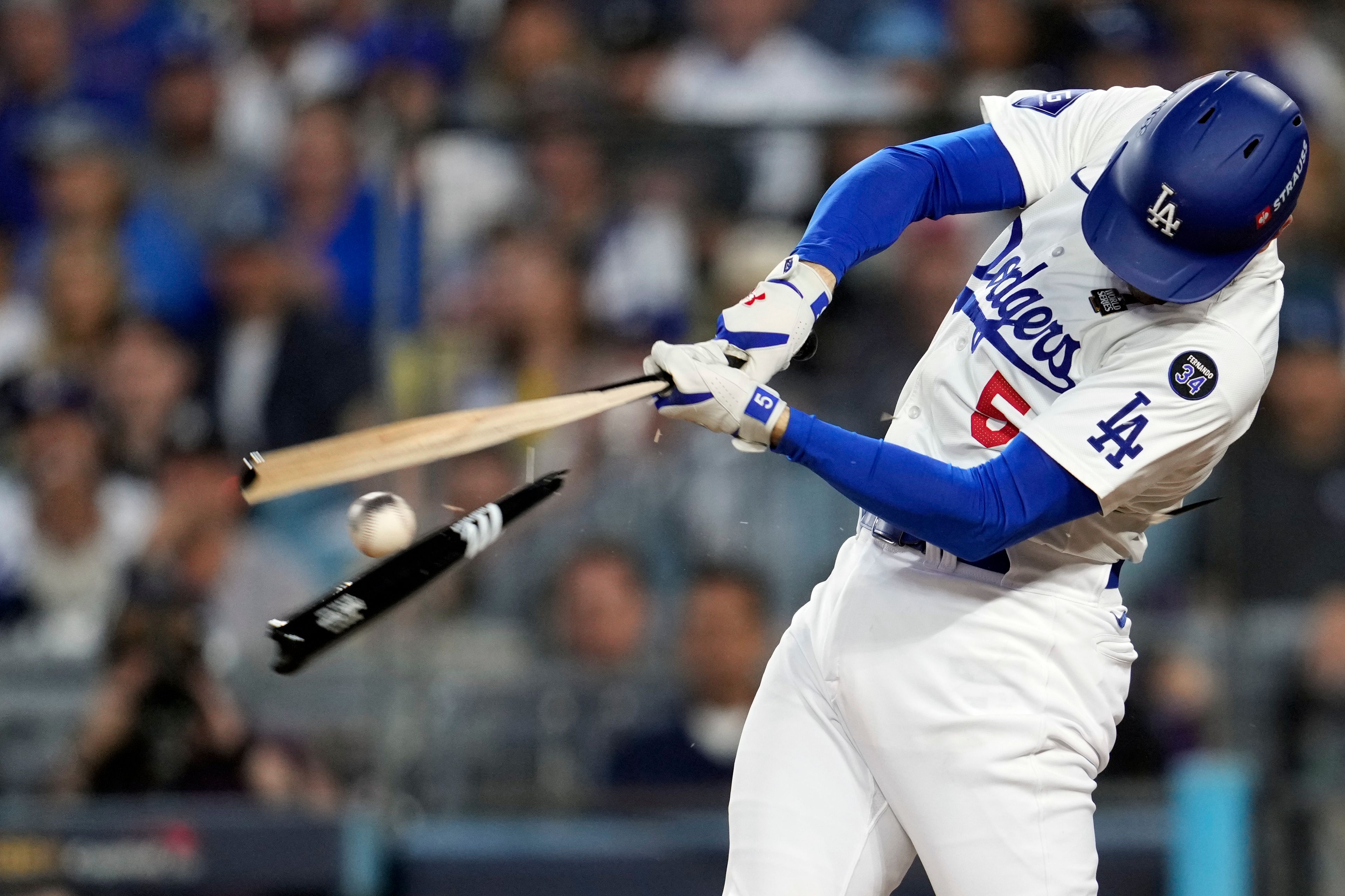 Los Angeles Dodgers' Freddie Freeman breaks his bat hitting a ground out against the New York Yankees during the fourth inning in Game 1 of the baseball World Series, Friday, Oct. 25, 2024, in Los Angeles. (AP Photo/Godofredo A. Vásquez)