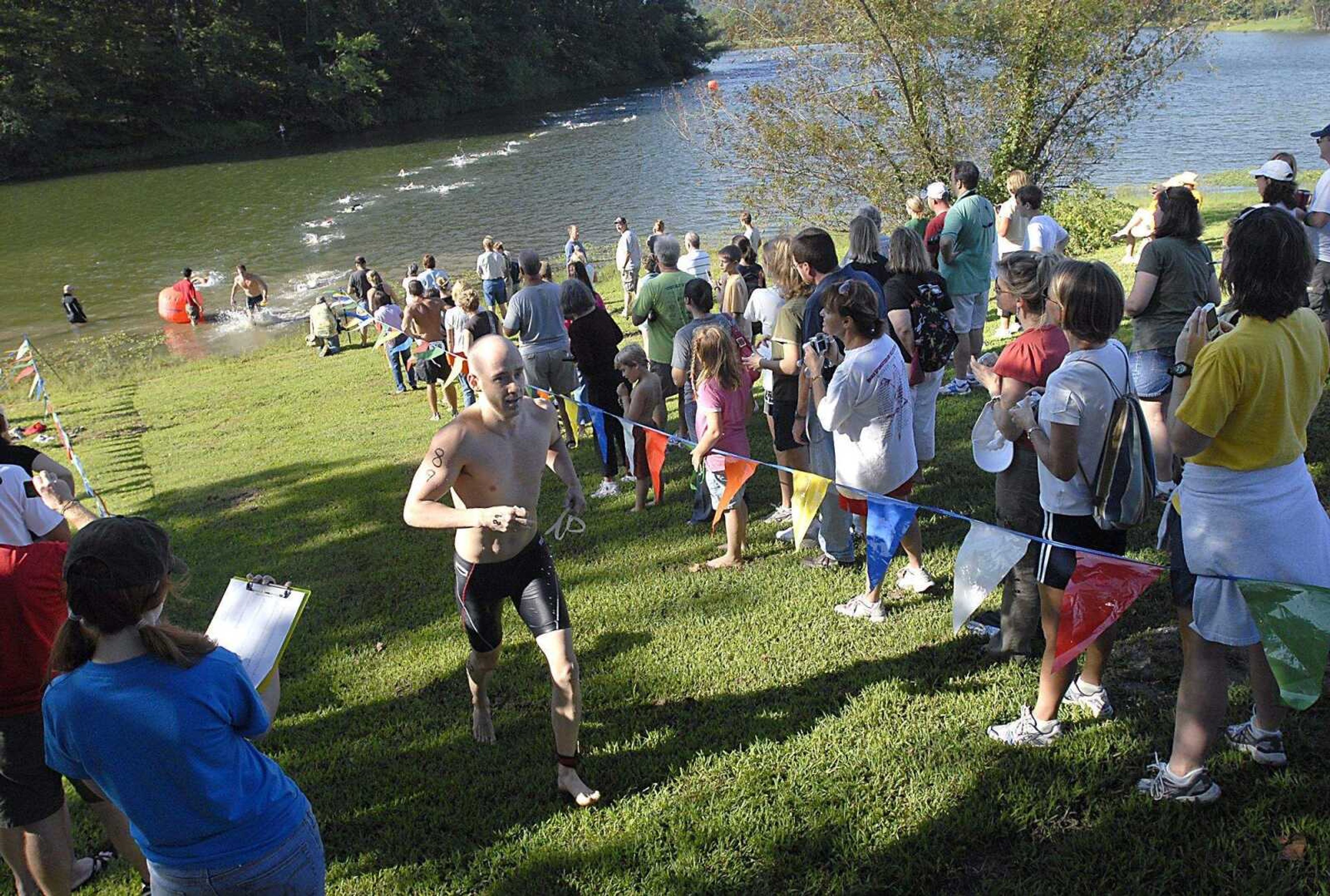 FRED LYNCH ~ flynch@semissourian.com
Swimmers exit Boutin Lake in the 2008 Coors Light/Trail of Tears Triathlon Saturday.