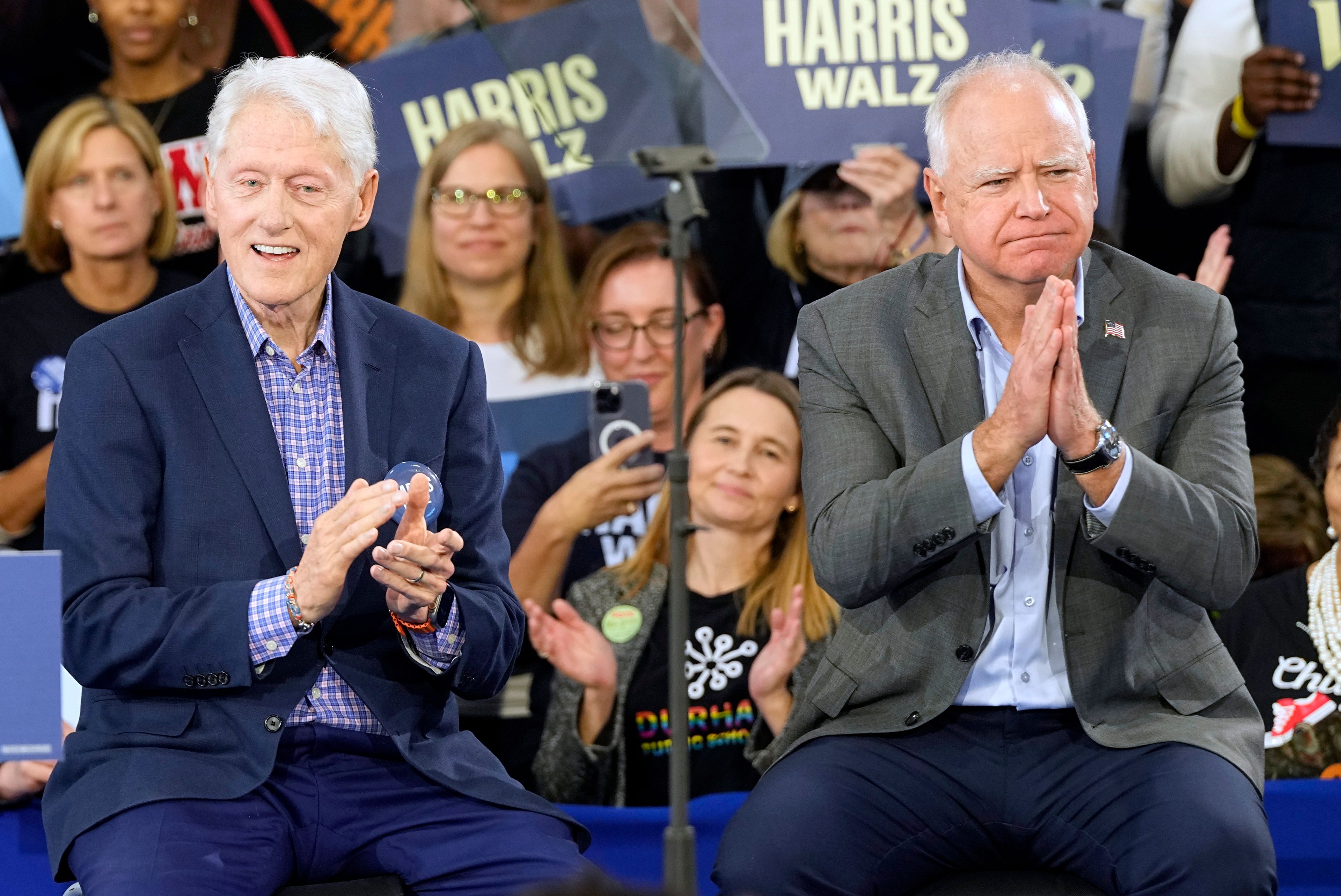 Democratic vice presidential nominee Minnesota Gov. Tim Walz, appears with former President Bill Clinton at a campaign rally in Durham, N.C., Thursday, Oct. 17, 2024. (AP Photo/Steve Helber)