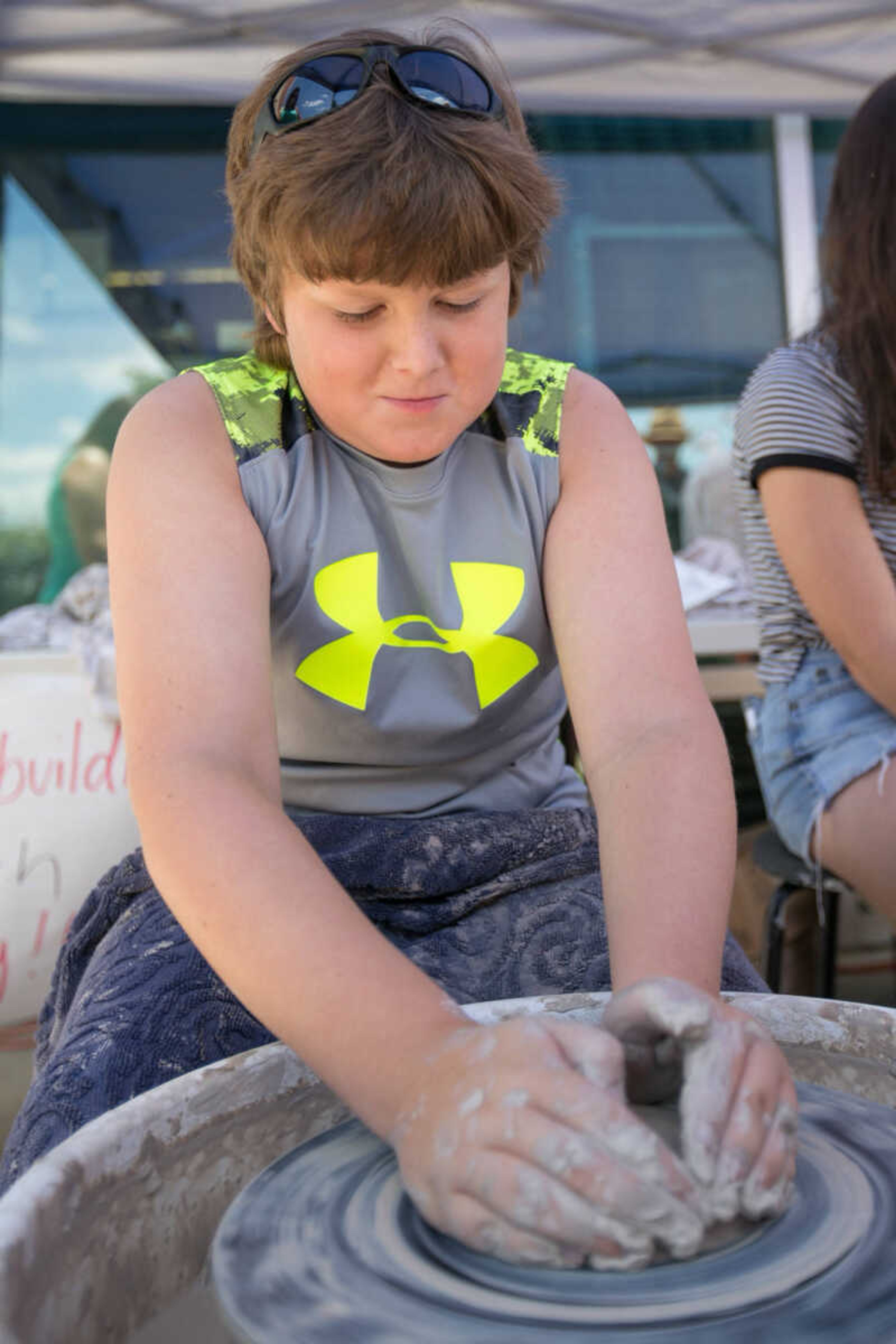 GLENN LANDBERG ~ glandberg@semissourian.com

Jacob Seabaugh tries his hand at pottery Saturday, June 18, 2016 at the River Campus Summer Arts Festival.