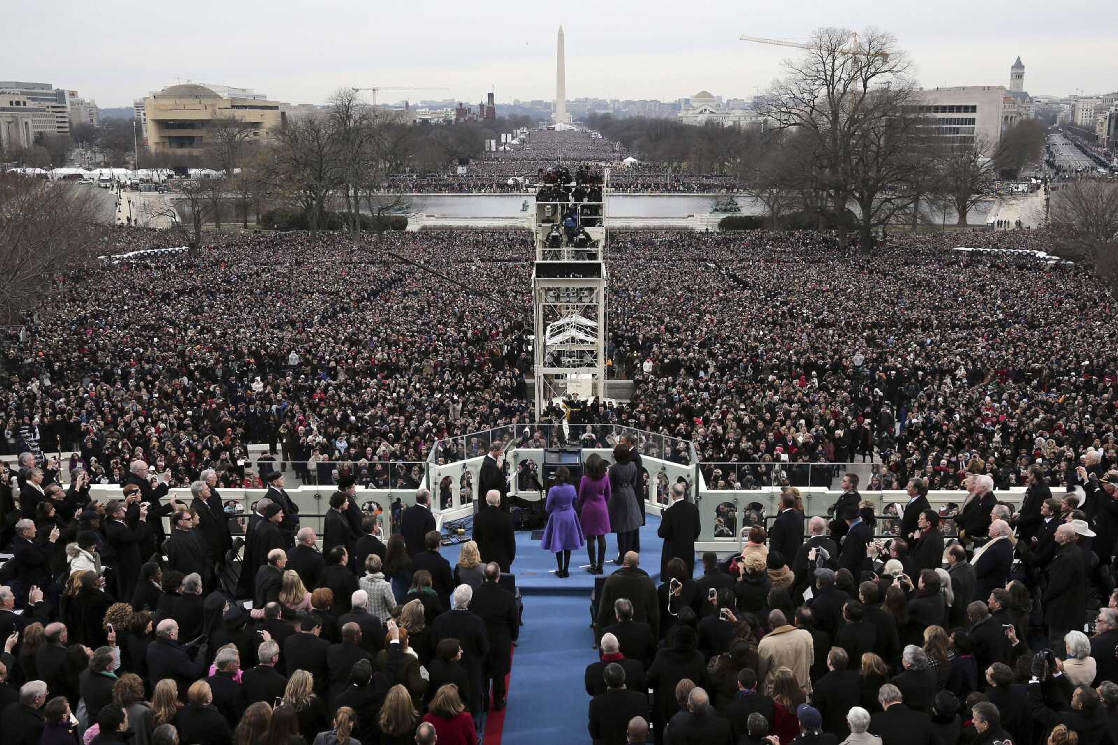 President Barack Obama is sworn Jan. 21, 2013, in by Chief Justice John Roberts on the West Front of the Capitol in Washington. Donald Trump said his inauguration will have "an unbelievable, perhaps record-setting turnout." Exactly how many people actually will show up likely never will be known.