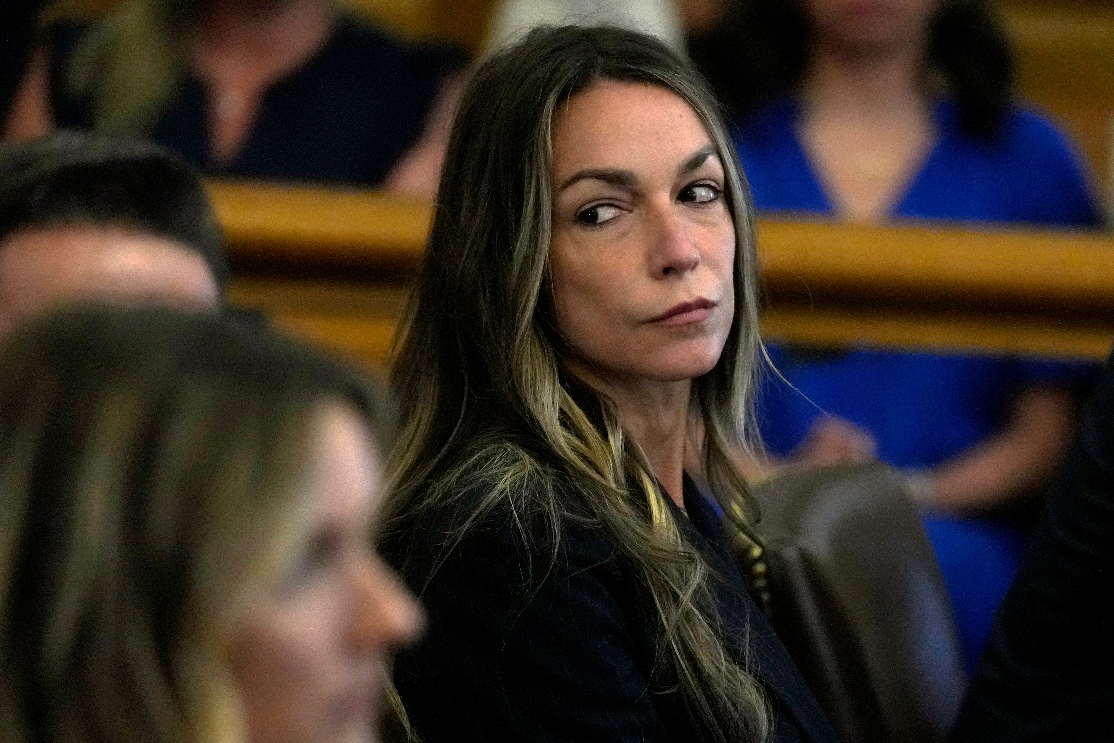 FILE - Karen Read waits for her court case to resume at Norfolk Superior Court in Dedham, Mass., June 28, 2024. (AP Photo/Charles Krupa, Pool, File)