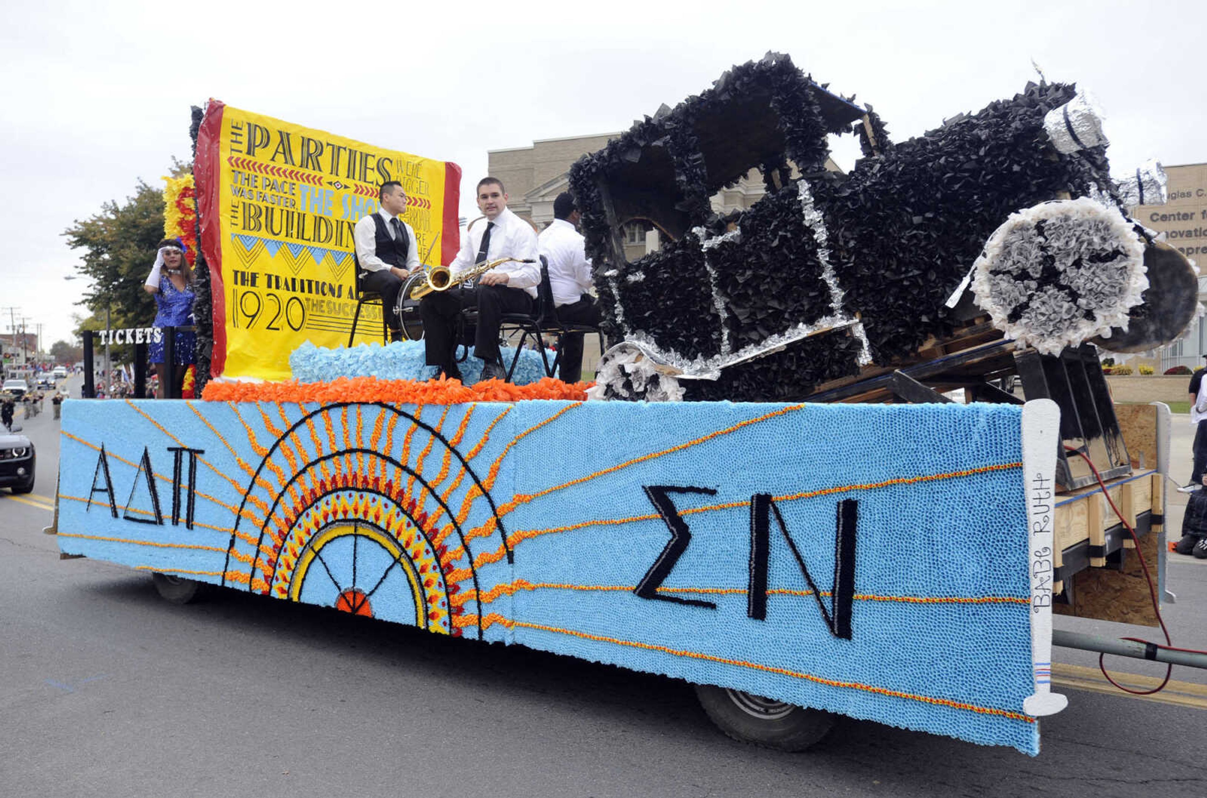 A float by Alpha Delta Pi and Sigma Nu proceeds in the SEMO Homecoming parade Saturday, Oct. 26, 2013 in Cape Girardeau.