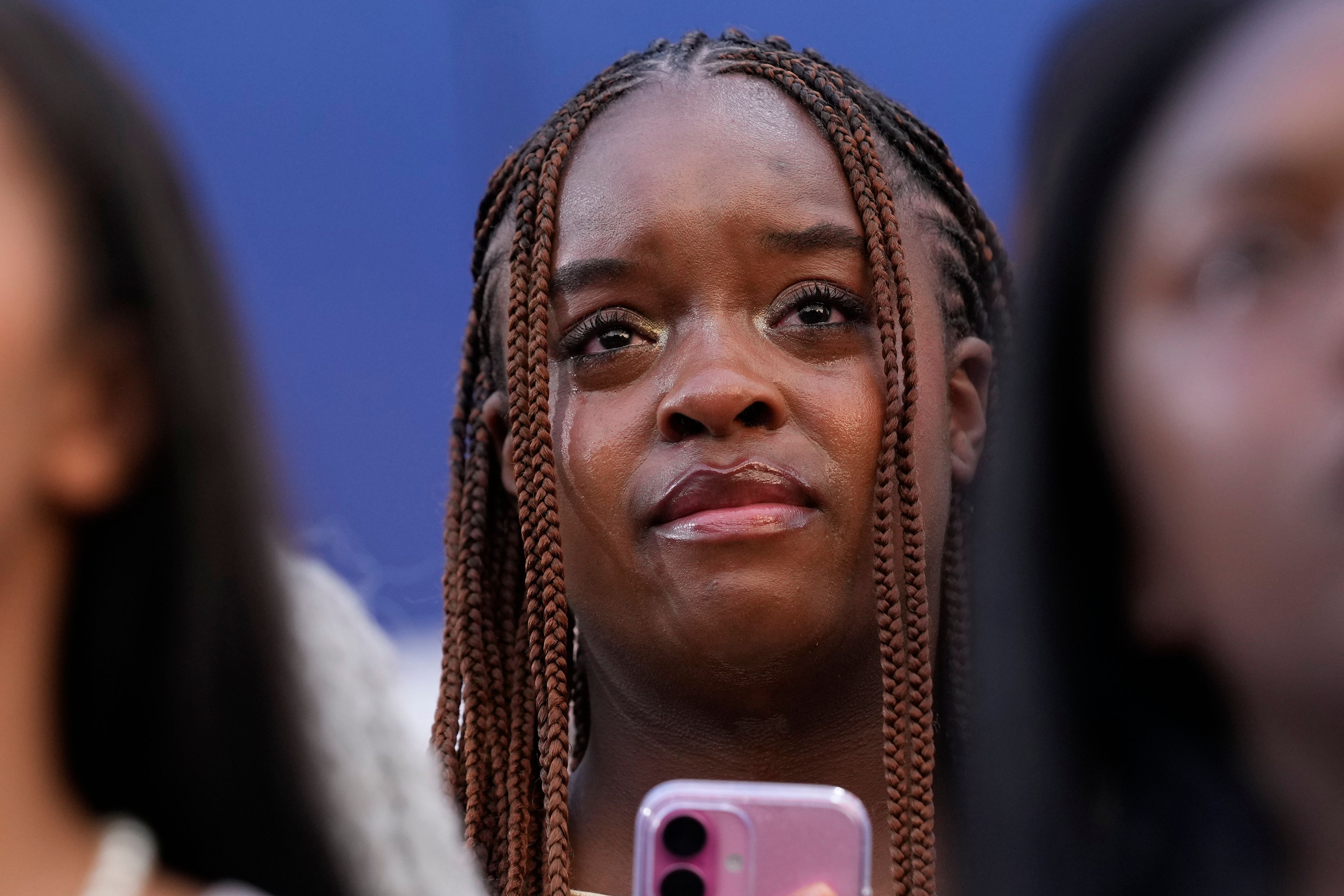 A supporter looks on as Vice President Kamala Harris delivers a concession speech for the 2024 presidential election, Wednesday, Nov. 6, 2024, on the campus of Howard University in Washington. (AP Photo/Susan Walsh)