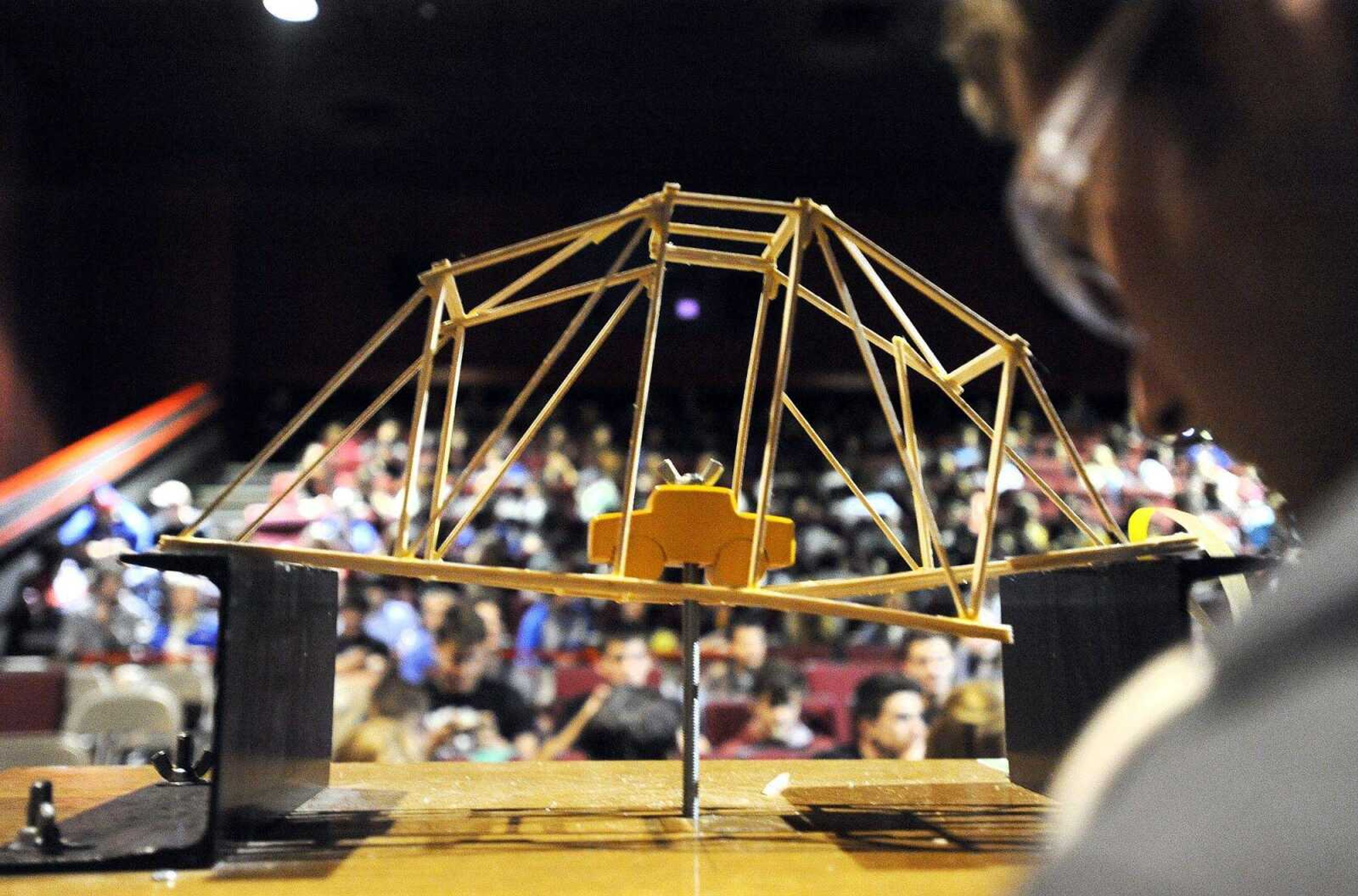 A truss bridge breaks from the weight Nov. 19, 2015, during the annual Missouri Department of Transportation bridge building competition at Cape West 14 Cine in Cape Girardeau.