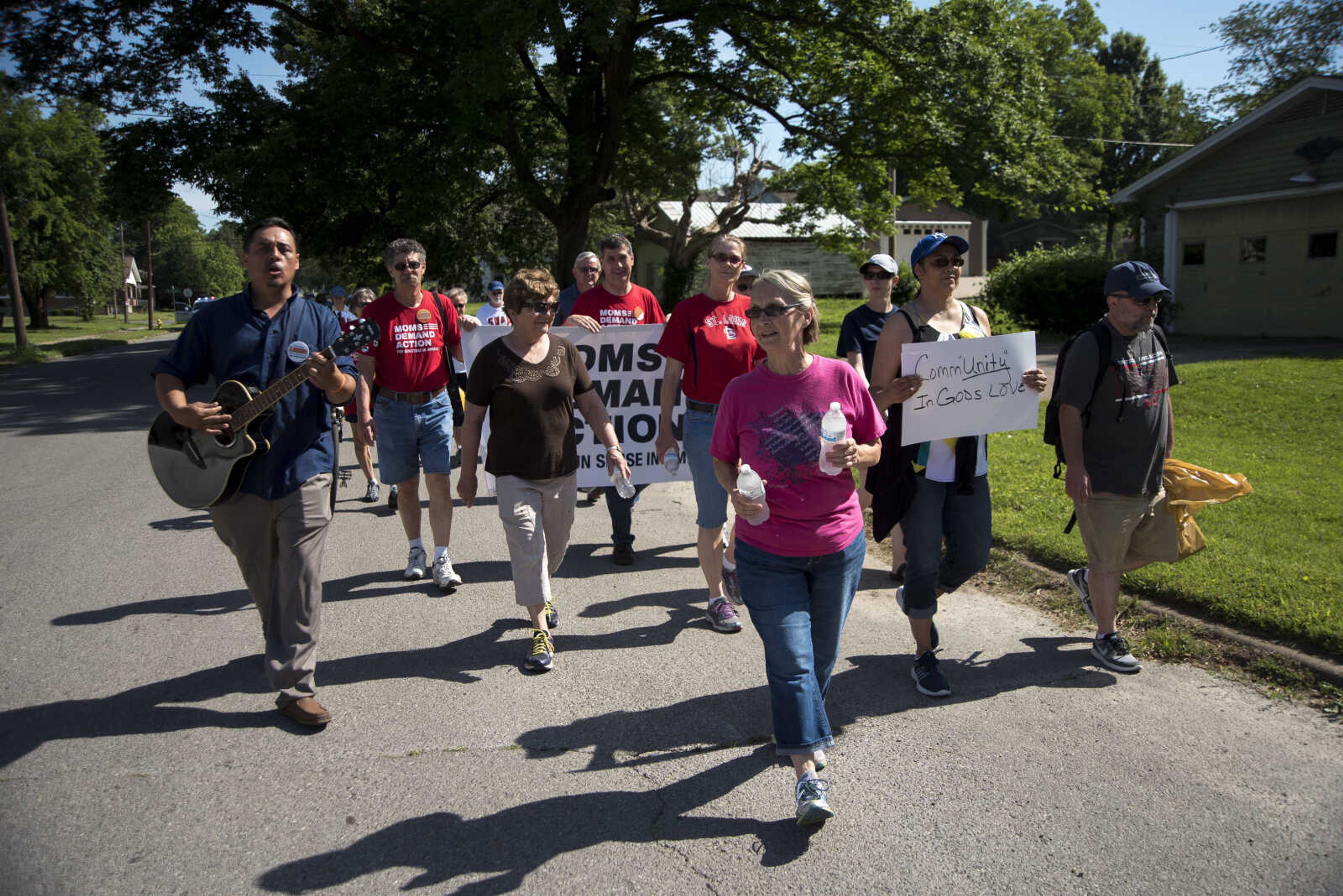 Community members march during a Stop Needless Acts of Violence Please (SNAP) prayer march Saturday, June 10, 2017 in Cape Girardeau.