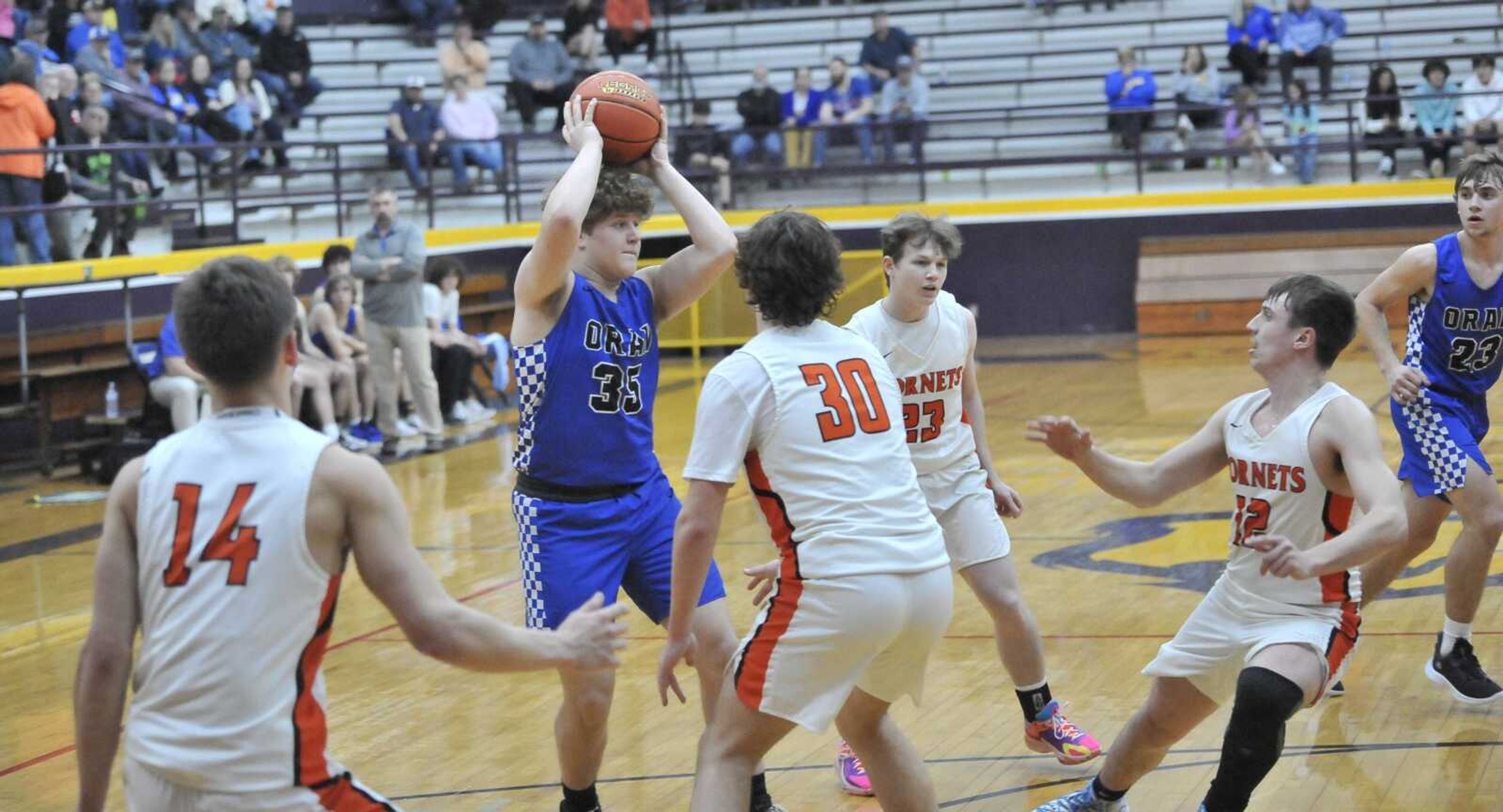 Oran junior Elijah Shoemaker gets surrounded by Advance defenders on Wednesday in the MSHSAA Class 2 District 3 Tournament semifinal game at Bloomfield.