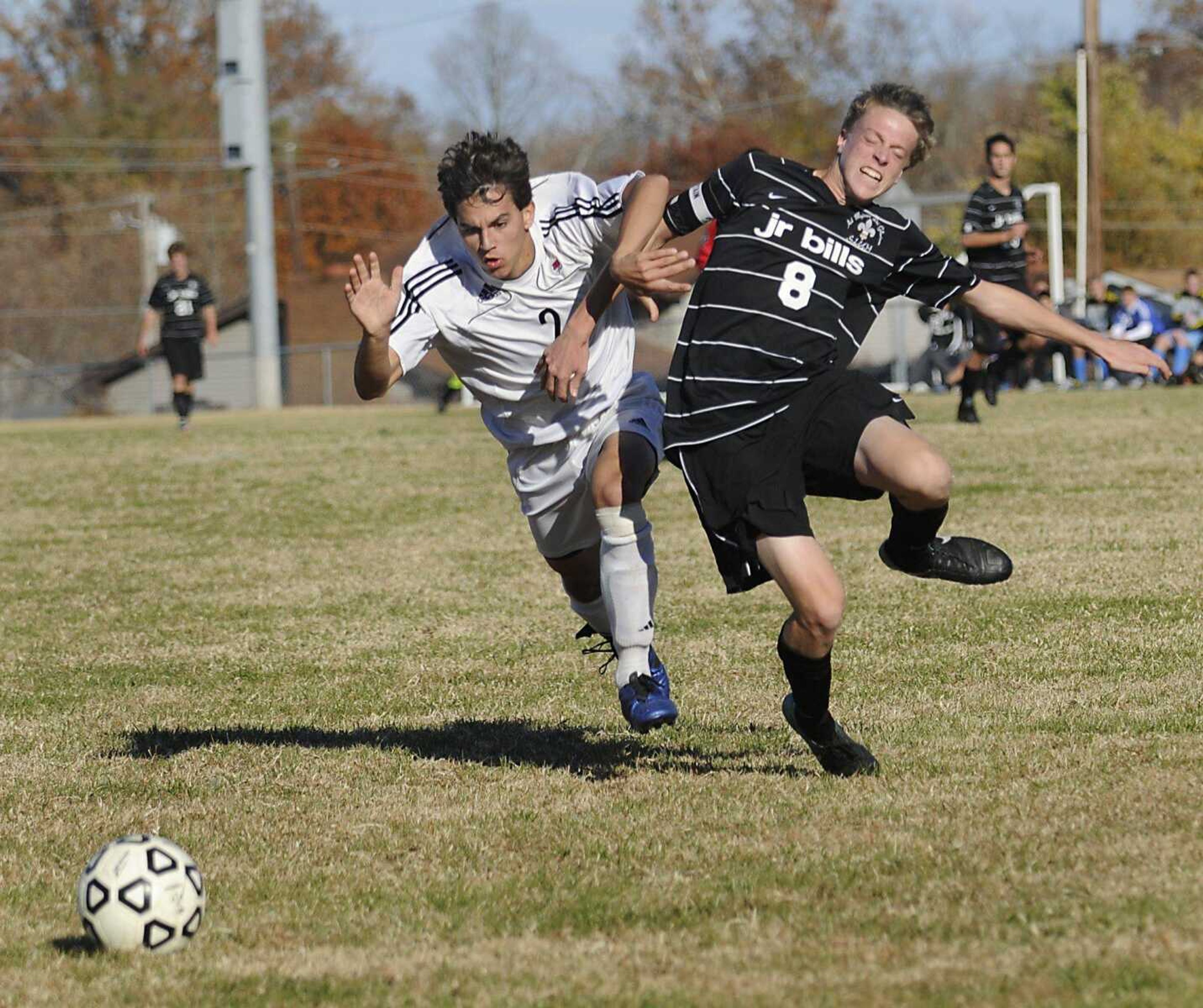 Jackson's Dylan Blaylock and Saint Louis University High's Rob Carr collide as they rush toward the ball during the second half Saturday.