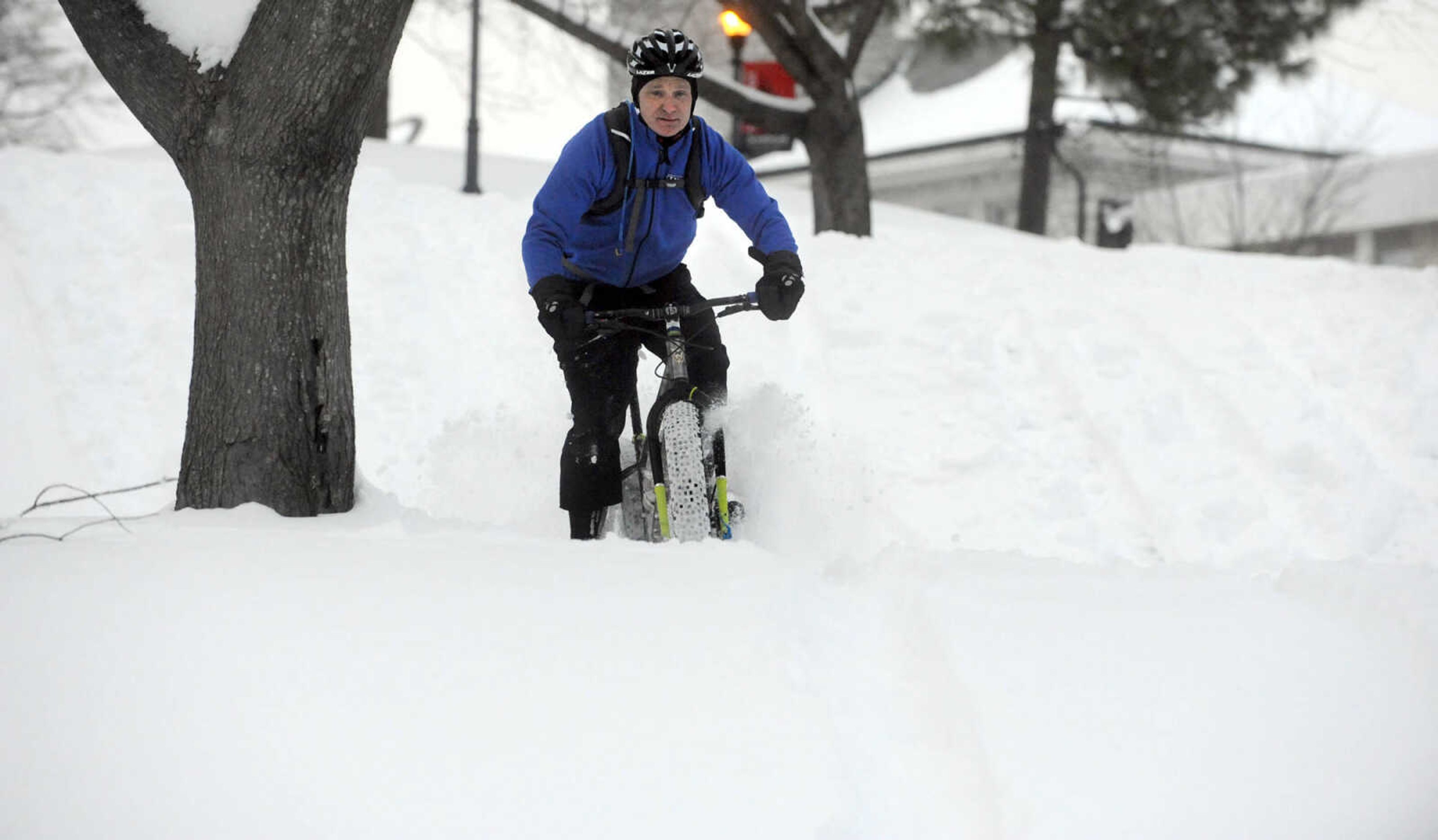 LAURA SIMON ~ lsimon@semissourian.com

John Dodd rides his fat bike through the snow on the terraces outside Academic Hall Tuesday evening, Feb. 17, 2015.