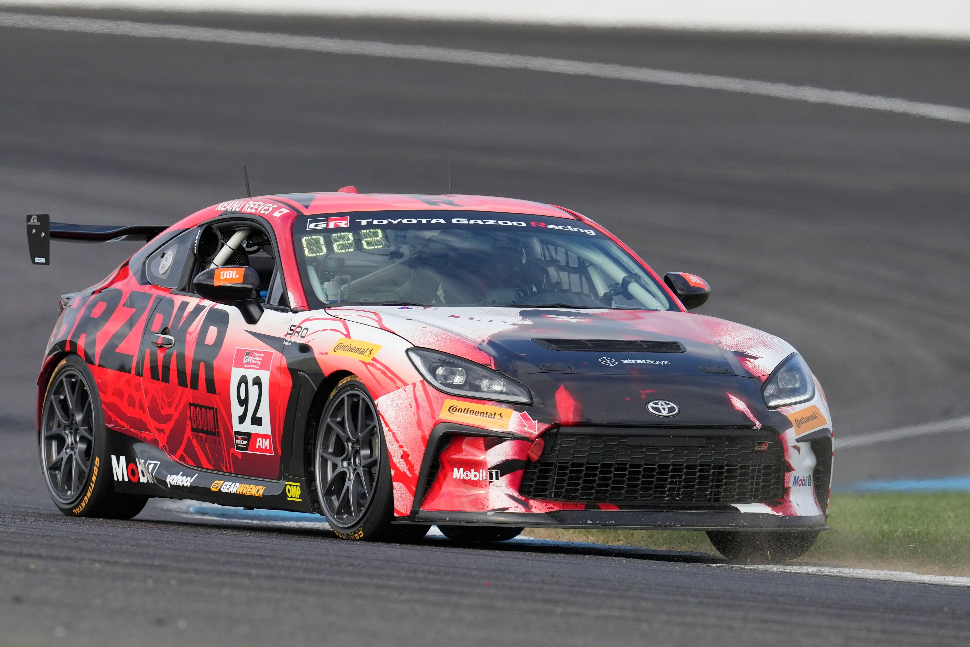 Keanu Reeves drives during the GR Cup Series auto race at Indianapolis Motor Speedway, Saturday, Oct. 5, 2024, in Indianapolis. (AP Photo/Darron Cummings)