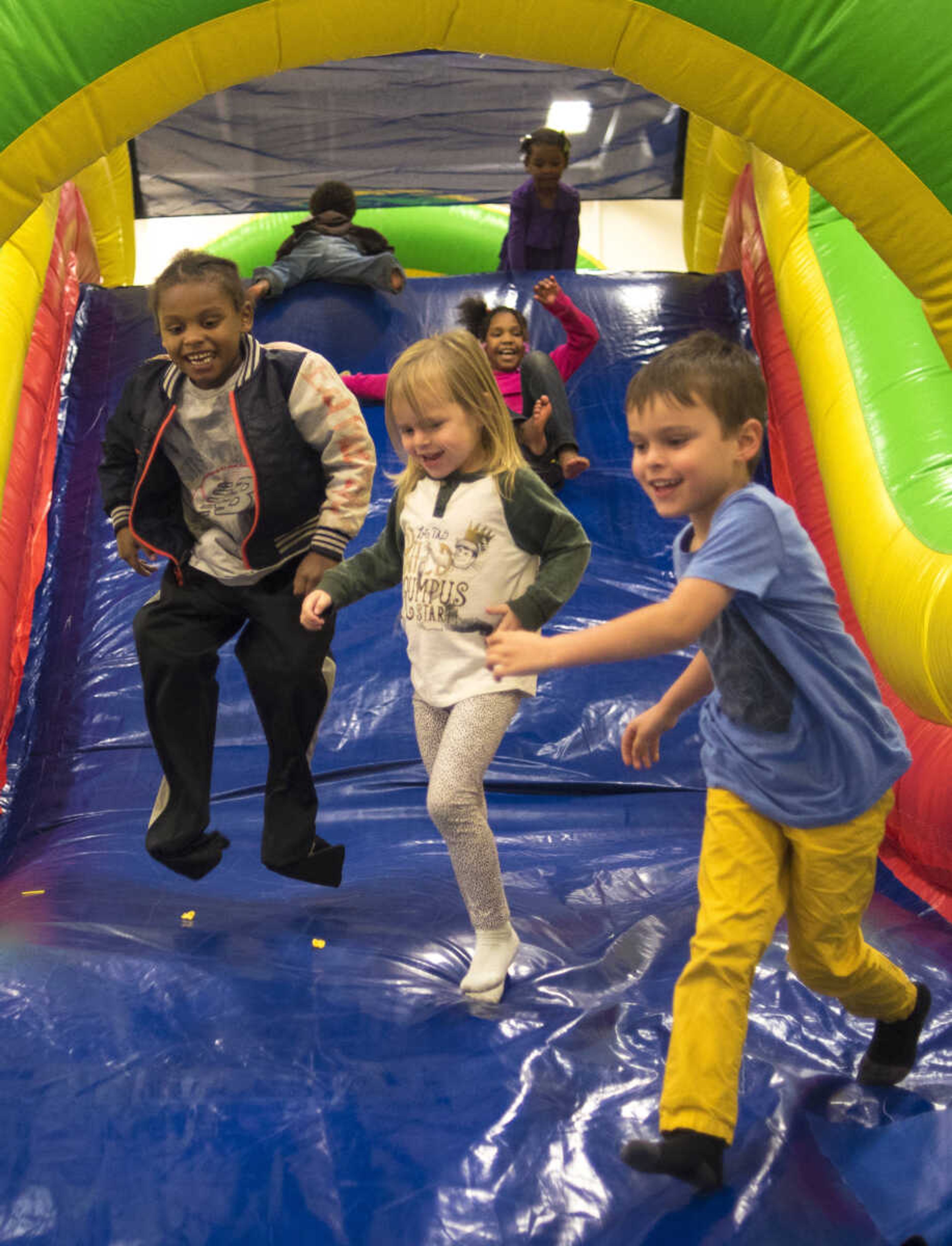 Kids play on an inflatable bounce house during the Fall Family Festival Friday, Nov. 17, 2017 at the Shawnee Park Center in Cape Girardeau.