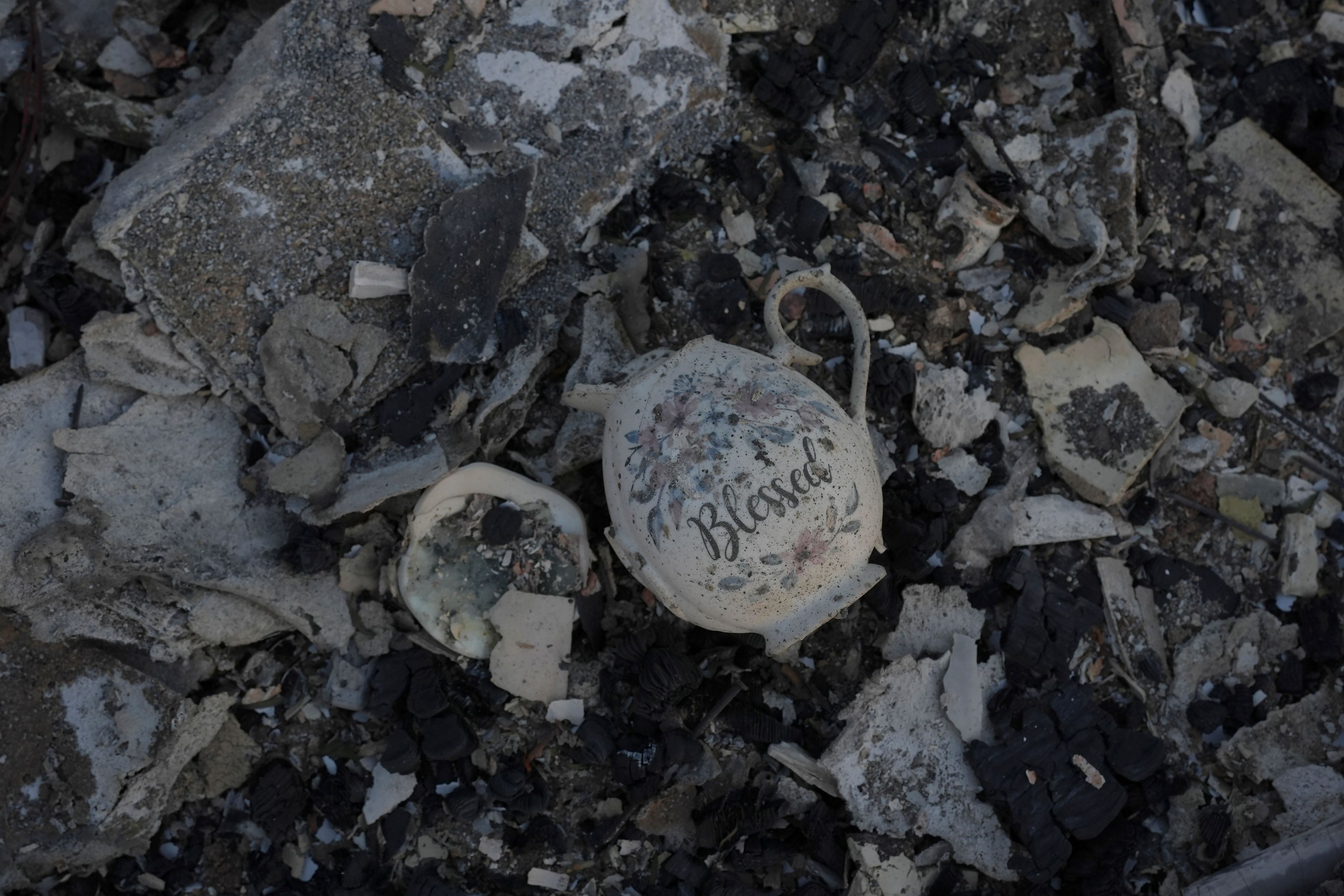 A tea cup sits with debris from a house destroyed by the Mountain Fire in Camarillo, Calif., Nov. 8, 2024. (AP Photo/Jae C. Hong)