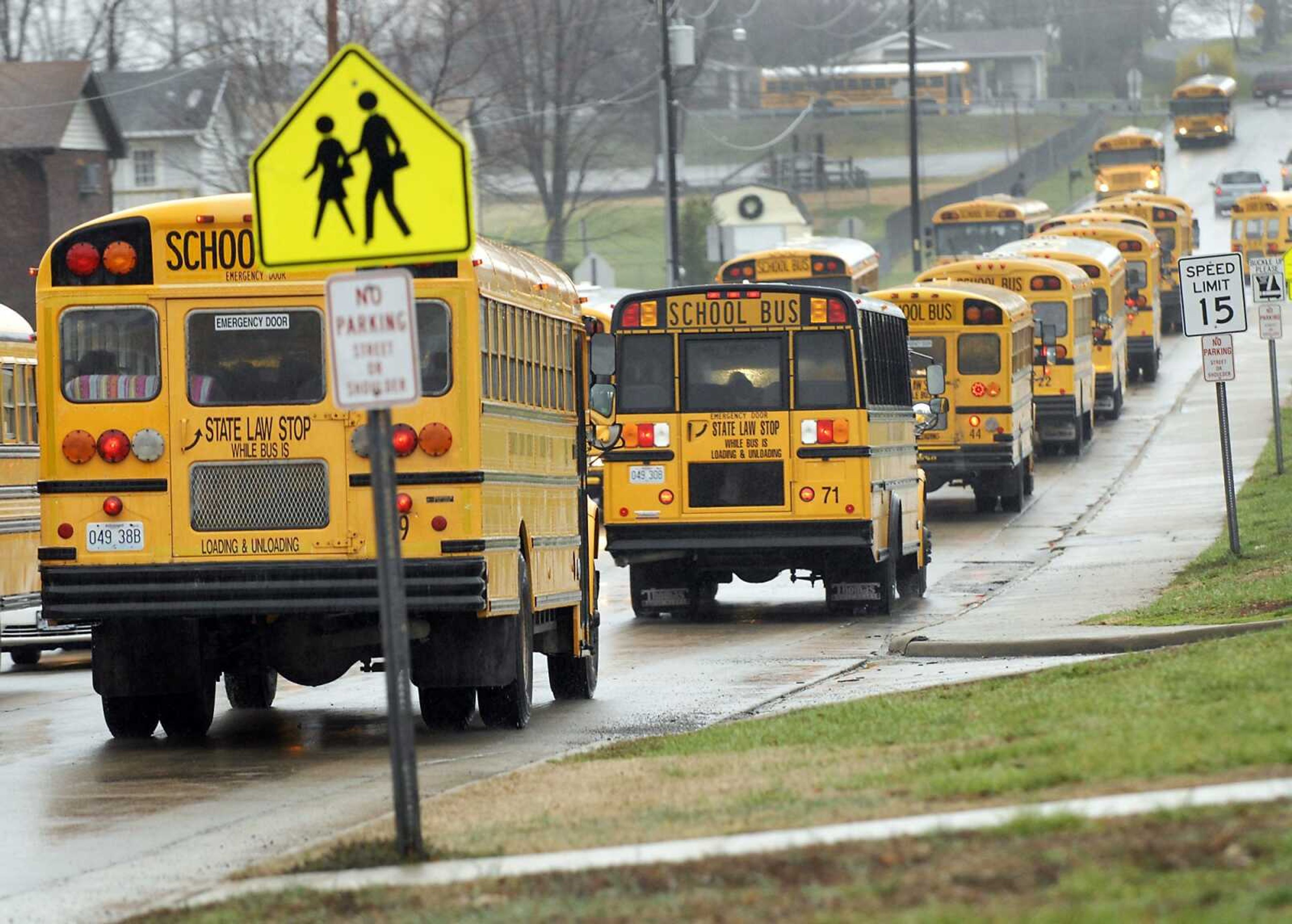 Buses head out on their afternoon routes after loading up students from Orchard Elementary in Jackson on Monday, March 14, 2011. Rising fuel costs are adding strain to school transportation budgets. (Kristin Eberts)