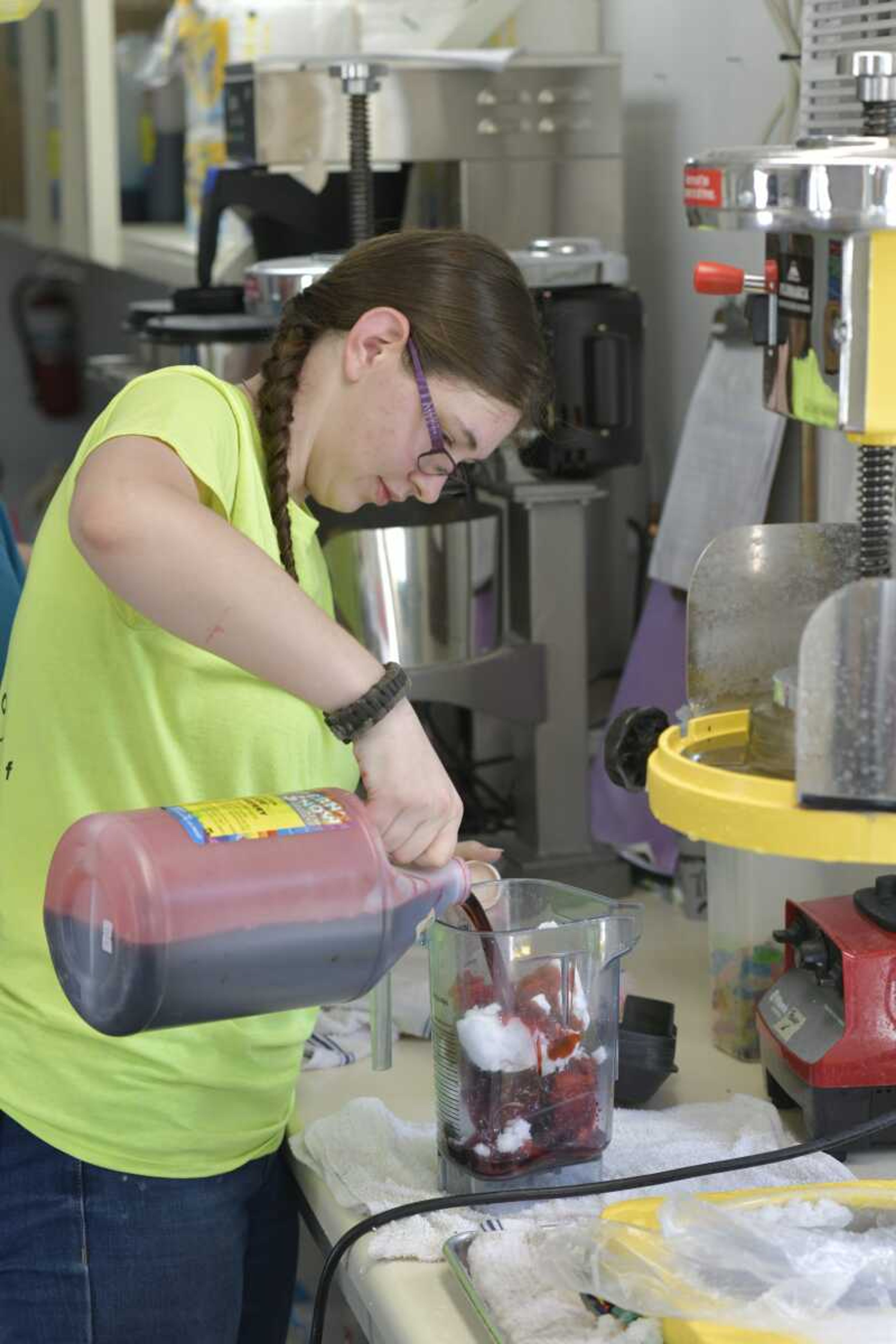 Emily at Ty's Summer Sno in Cape Girardeau makes a cherry slush to beat Tuesday's heat. Record-high temperatures in Cape Girardeau occurred Monday and Tuesday and were likely to continue through today.