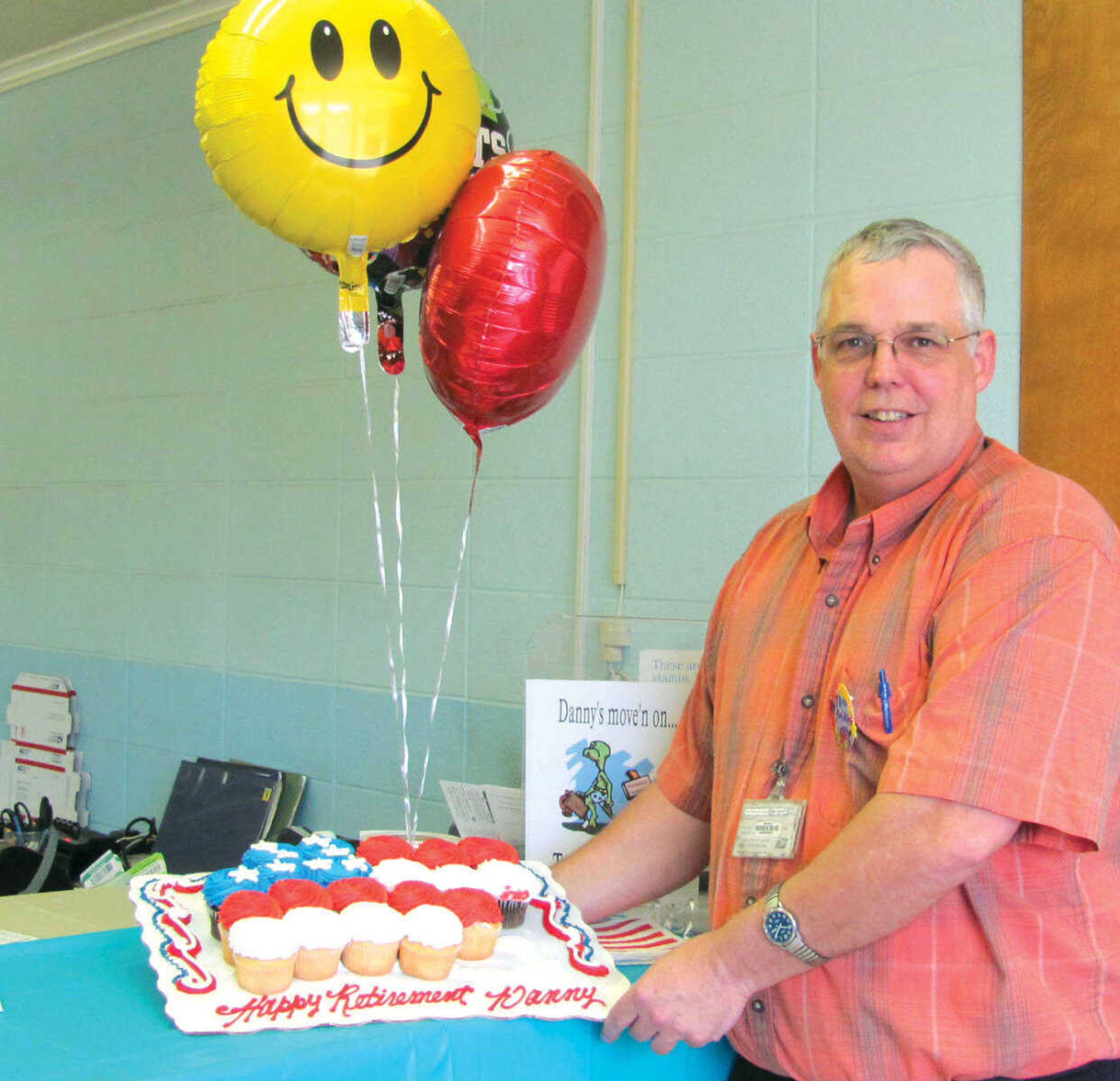 Danny Kern, postmaster at the Benton post office, retired Friday after almost 34 years with the U.S. Postal Service. He'd been at the Benton location since 1996, and received a cake from co-workers, as well as balloons and cards from others in the community. (Michelle Felter, Standard Democrat)