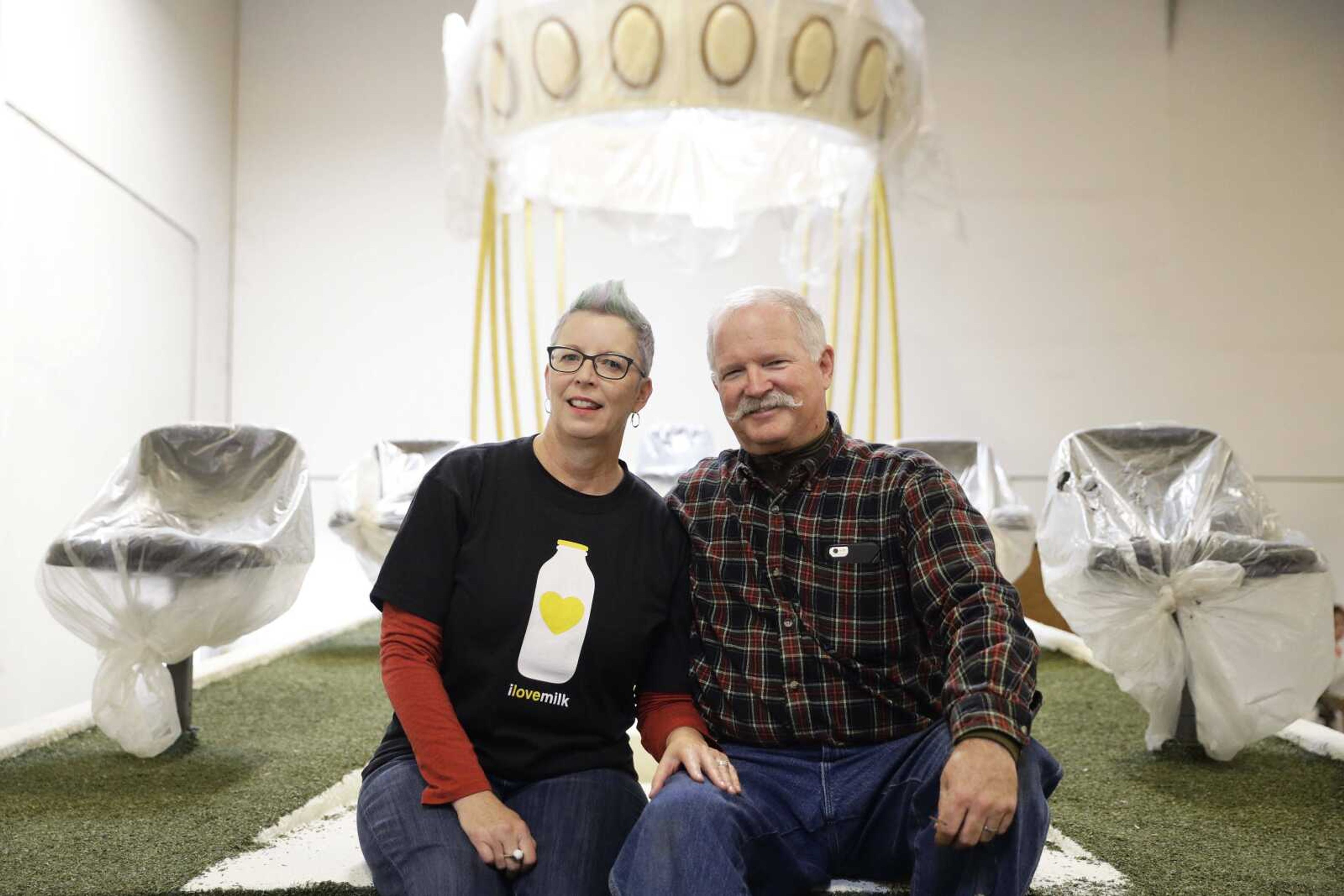 Christian Guntert and Susan Brown pose for photos Wednesday on a Rose Parade float they will get married on in Irwindale, California.