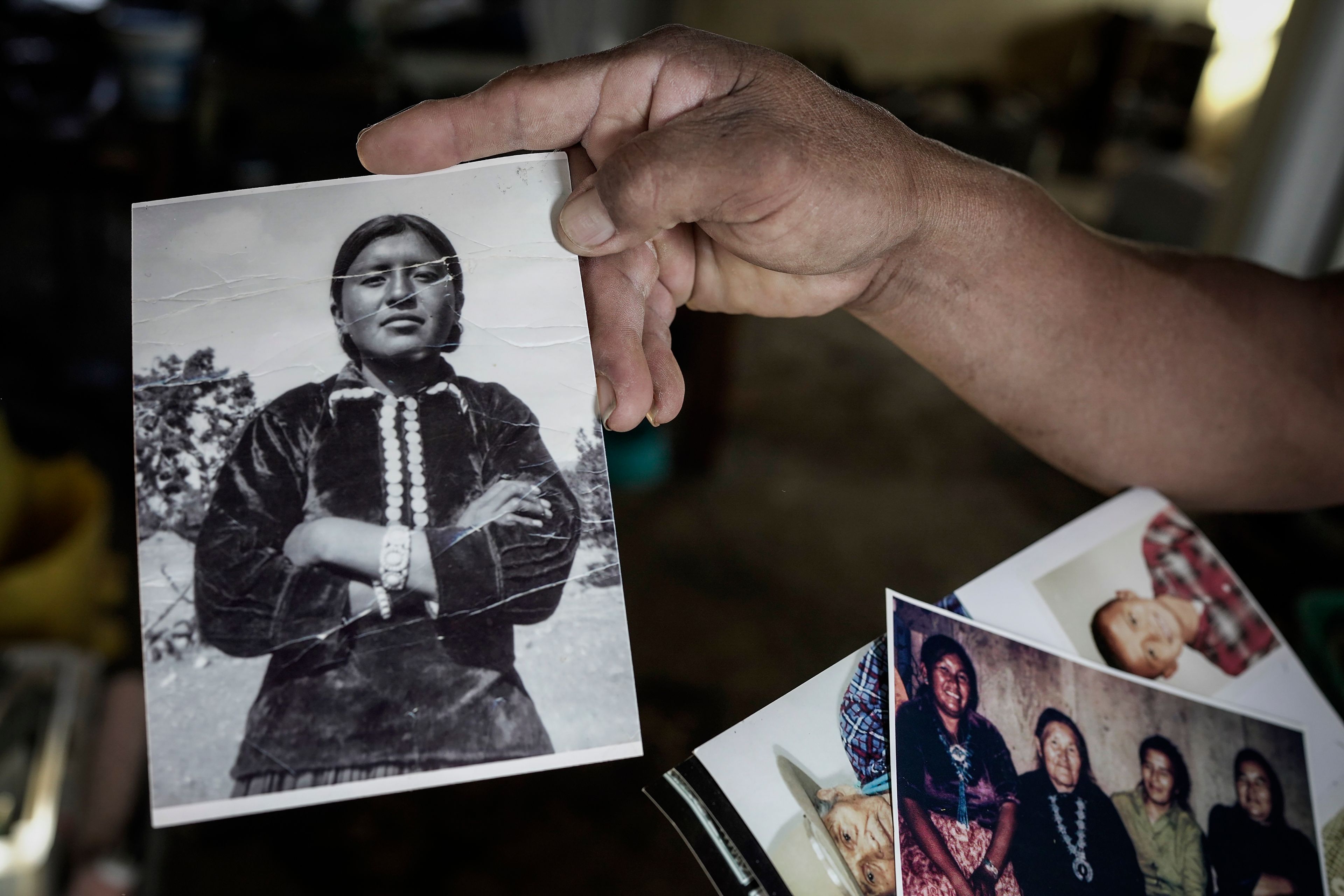 Richard Begay shows a portrait of his mother, at his home on the Navajo Nation in Dilkon, Ariz., Wednesday, Oct. 16, 2024. (AP Photo/Rodrigo Abd)