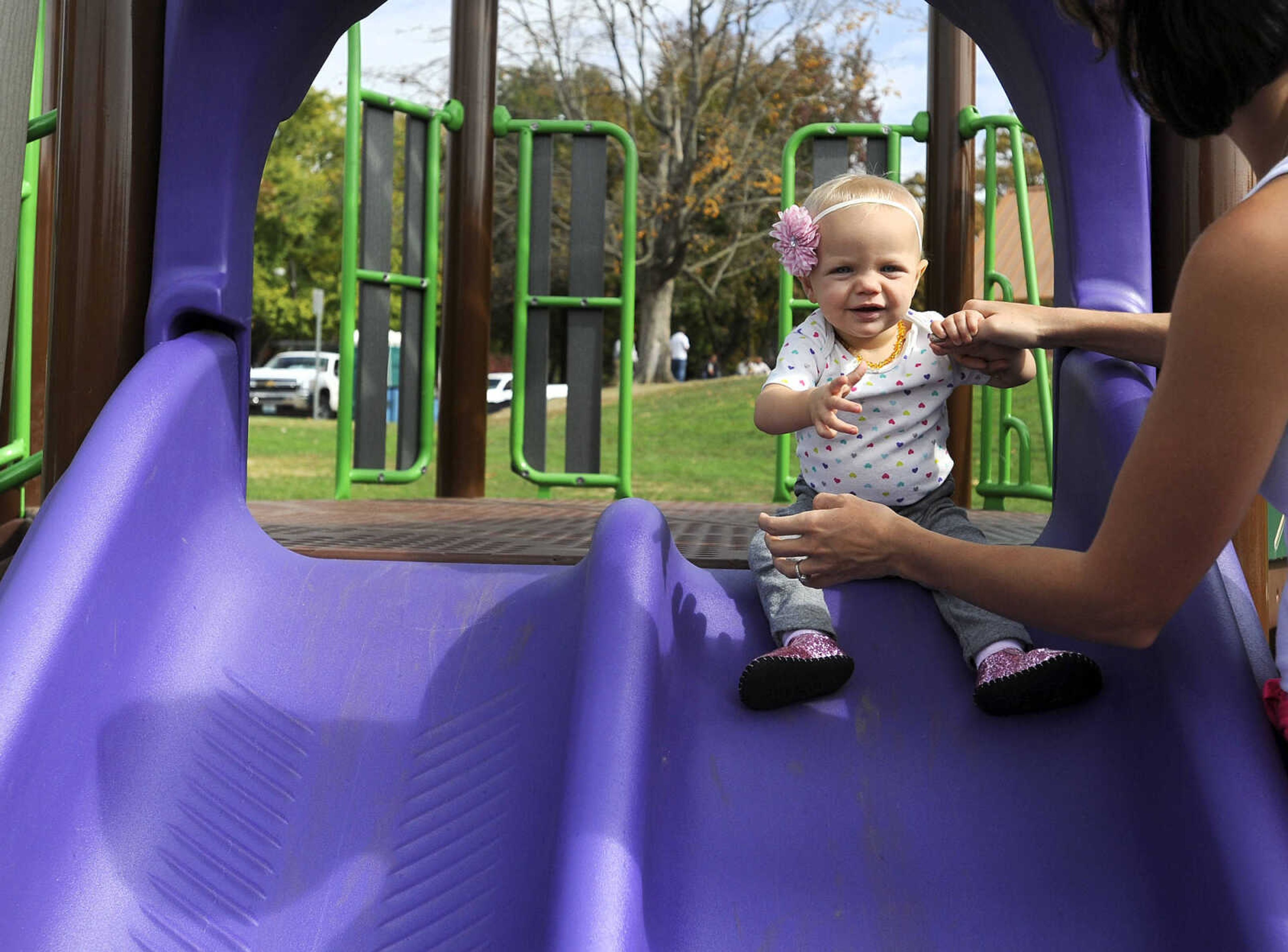 LAURA SIMON ~ lsimon@semissourian.com

Zoey Roth tries out the slides with some assistance at the new playground at Capaha Park, Friday, Oct. 23, 2015, in Cape Girardeau.