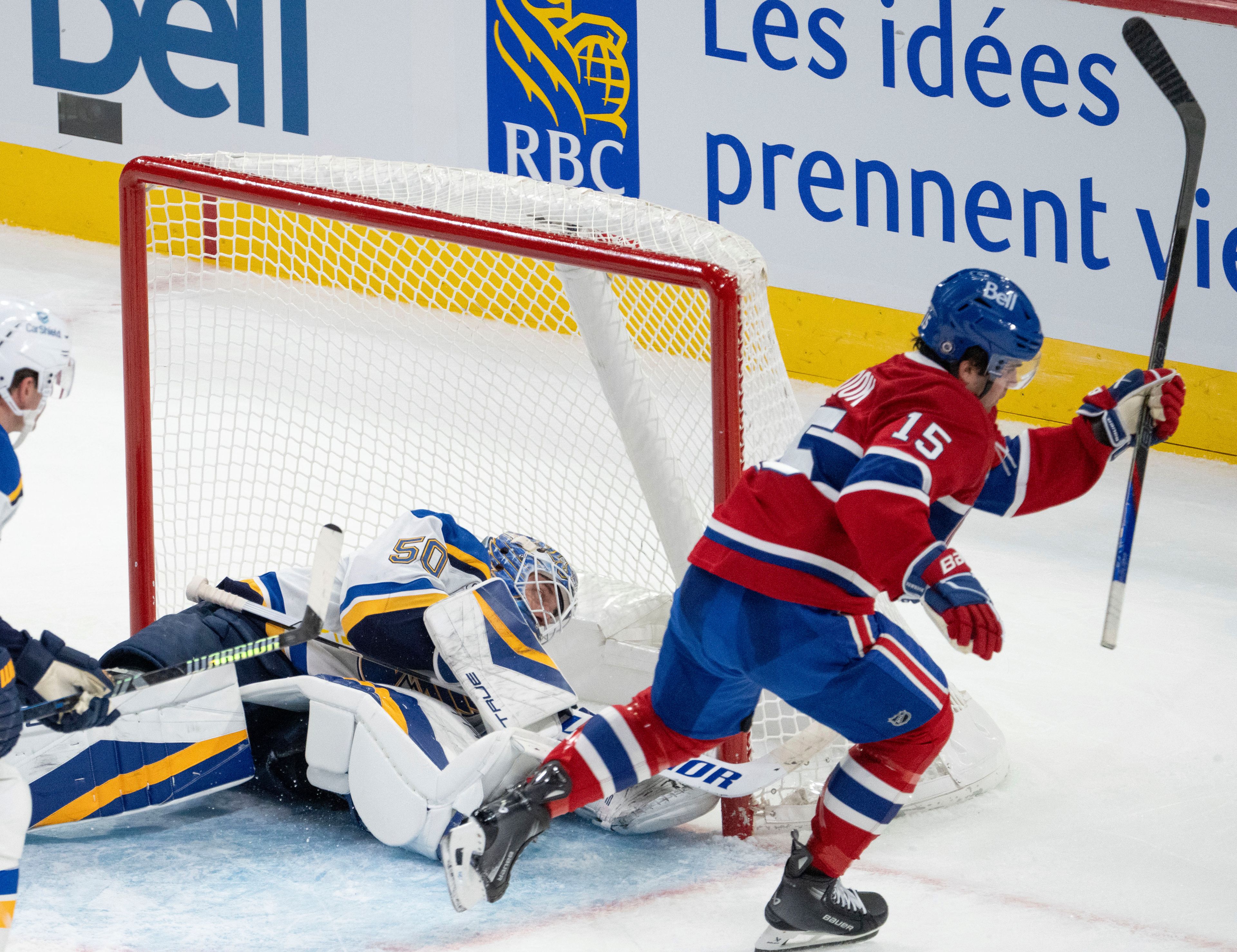 Montreal Canadiens' Alex Newhook (15) scores on St. Louis Blues goaltender Jordan Binnington (50) during second period NHL hockey action Saturday, October 26, 2024 in Montreal. (Ryan Remiorz/The Canadian Press via AP)