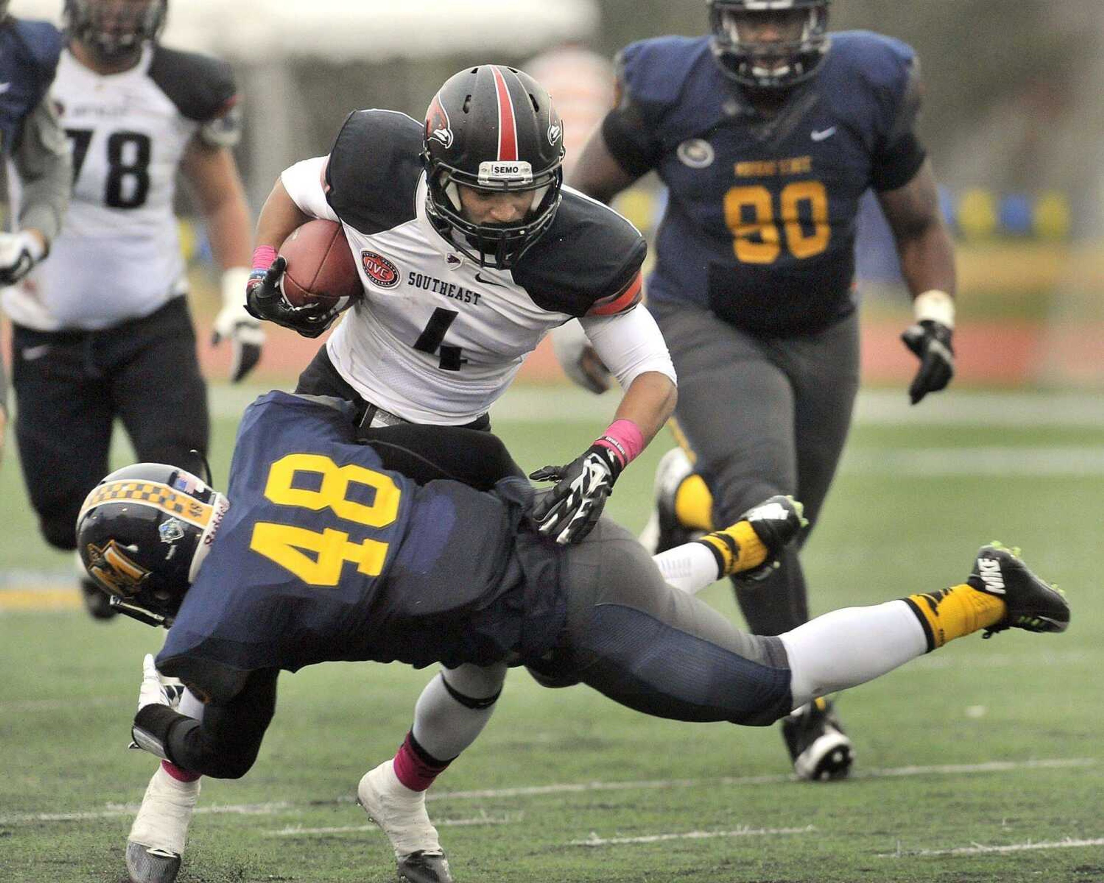 Southeast Missouri State wide receiver Spencer Davis runs into Murray State's St. Pierre Anilus on a 7-yard Kyle Snyder pass during the third quarter Saturday, Oct. 11, 2014 in Murray, Kentucky. (Fred Lynch)