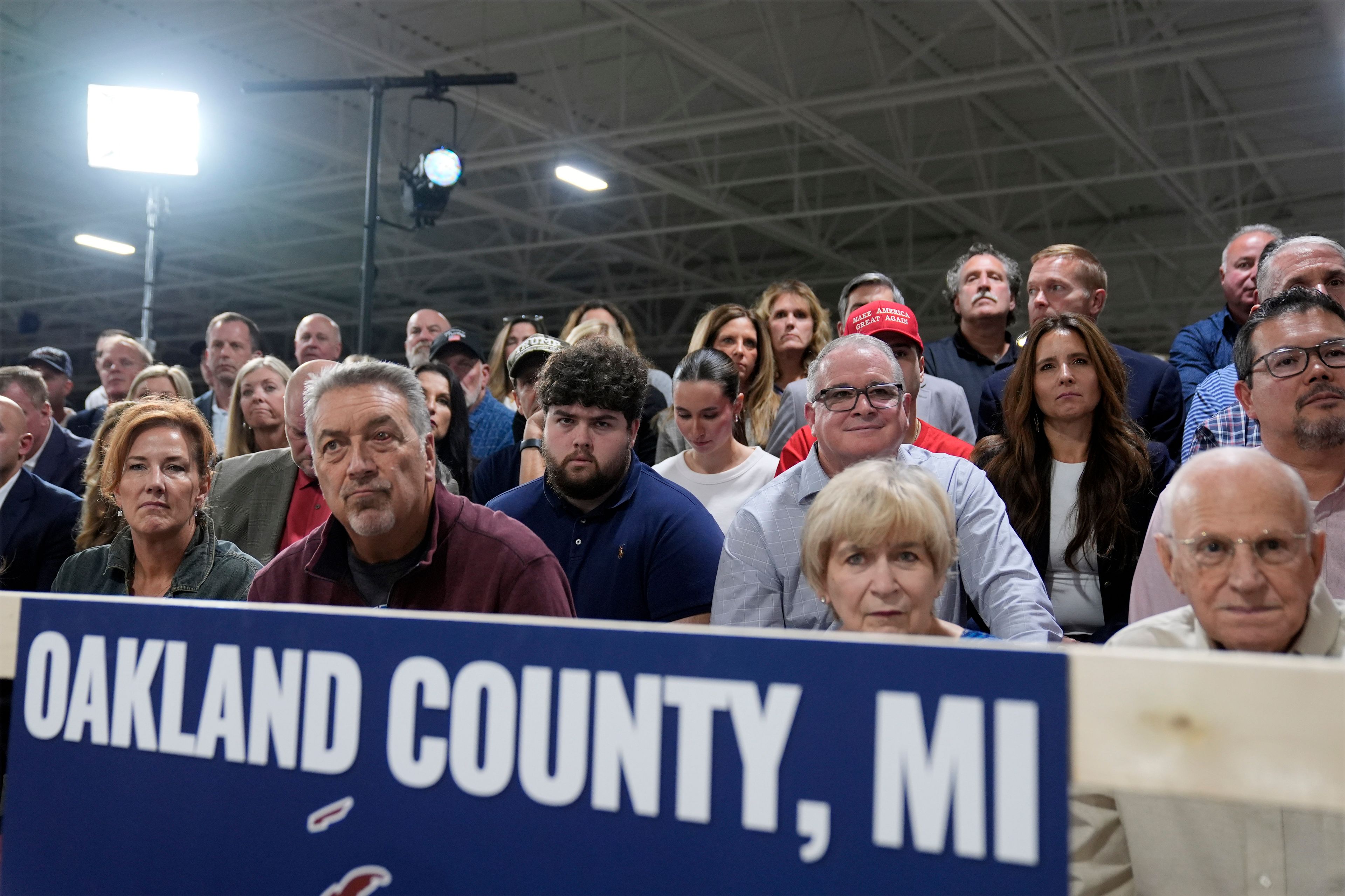 Supporters listen as Republican presidential nominee former President Donald Trump speaks at a campaign roundtable, Friday, Oct. 18, 2024, in Auburn Hills, Mich. (AP Photo/Evan Vucci)