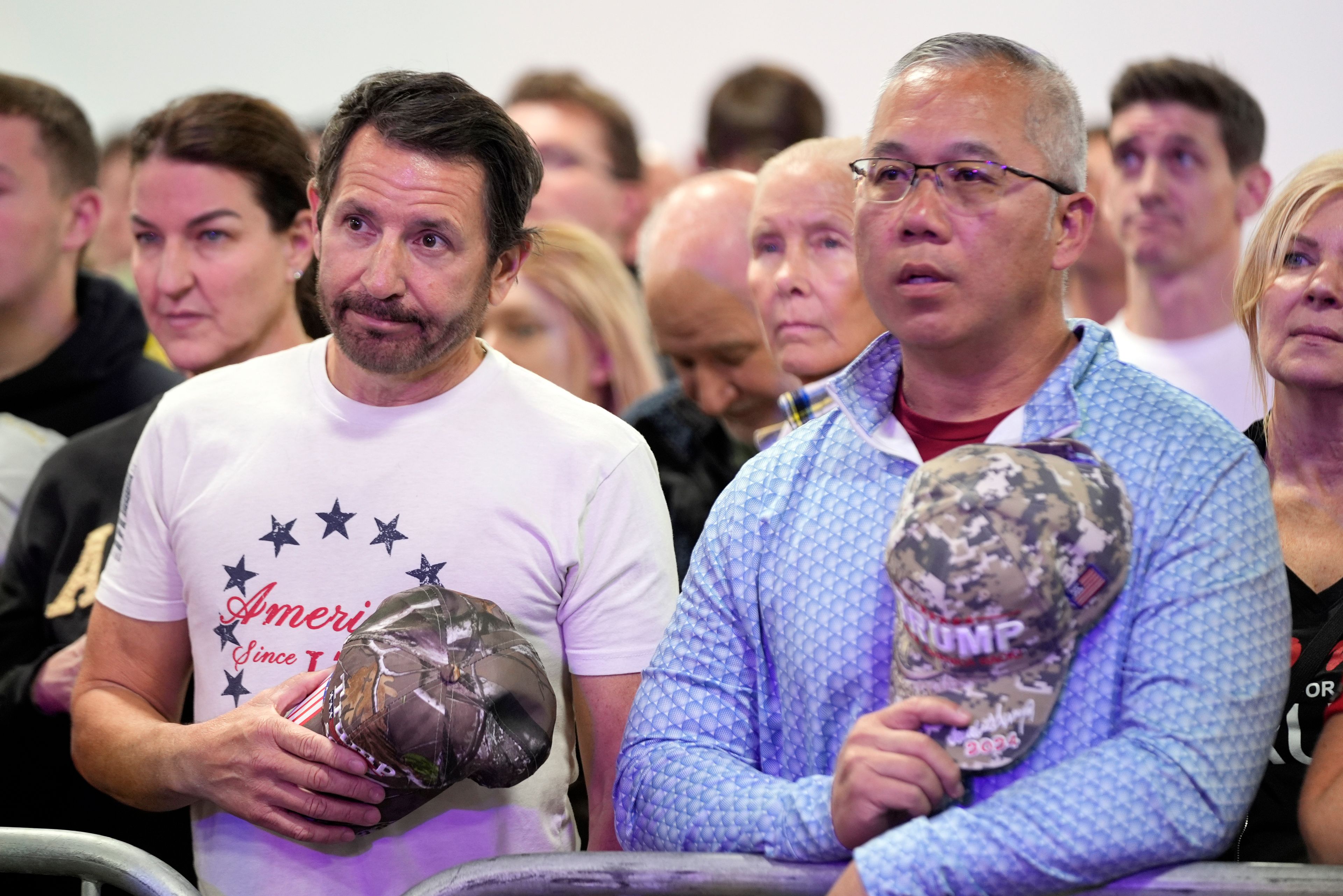 Supporters stand for the National Anthem before Republican presidential nominee former President Donald Trump speaks at a campaign town hall at the Greater Philadelphia Expo Center & Fairgrounds, Monday, Oct. 14, 2024, in Oaks, Pa. (AP Photo/Alex Brandon)