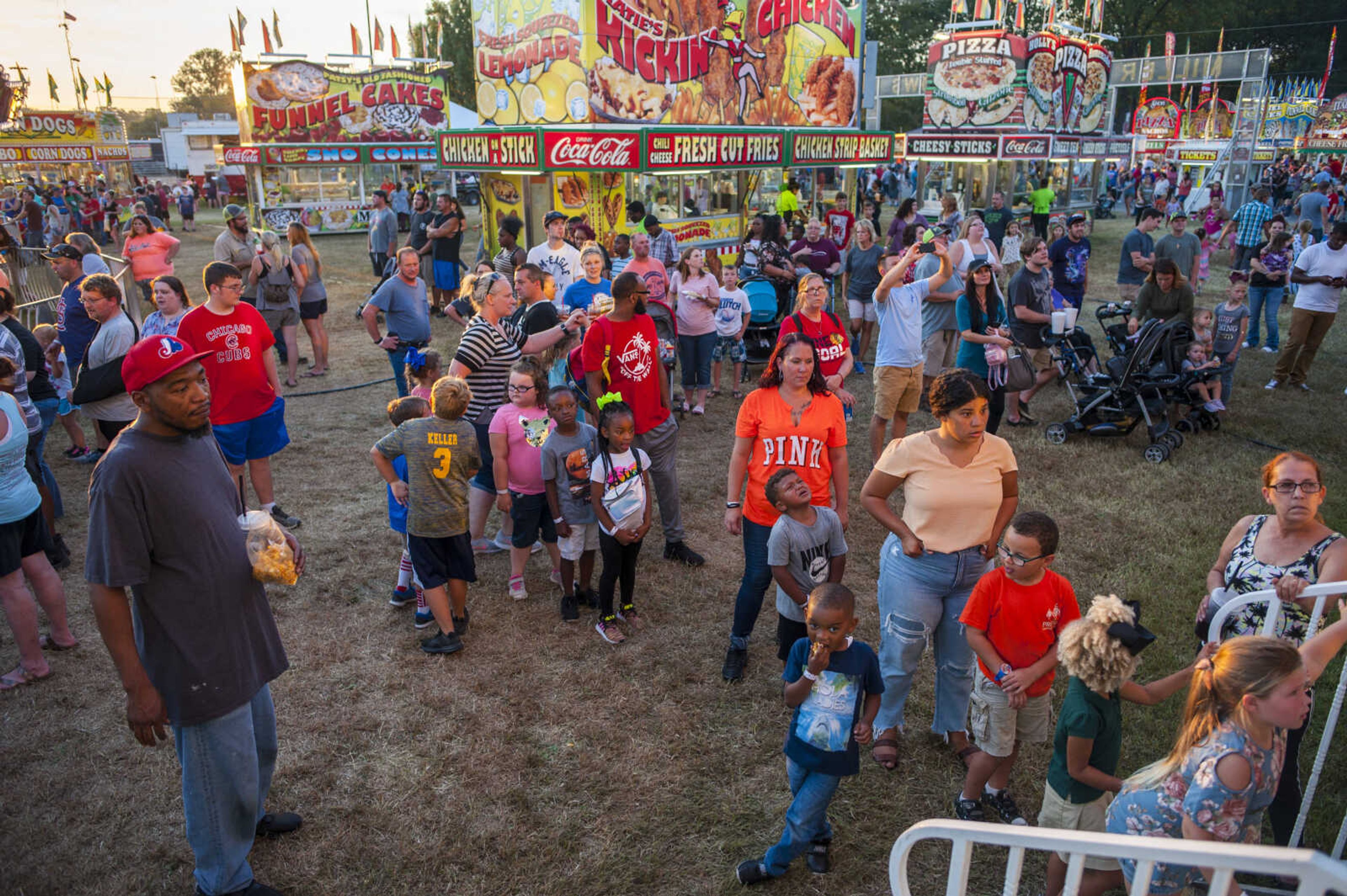 Fairgoers wait in line for the funhouse Tuesday, Sept. 10, 2019, during the SEMO District Fair at Arena Park in Cape Girardeau.