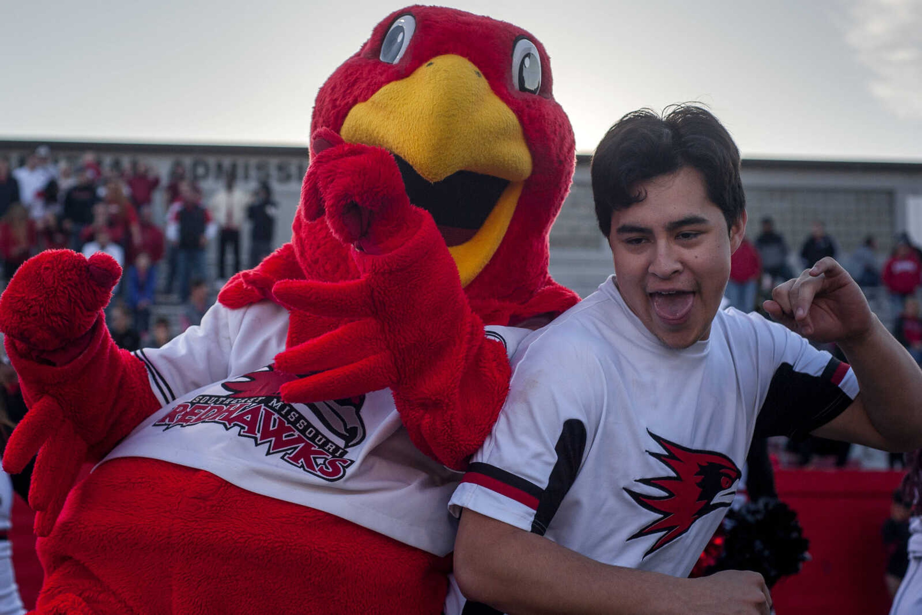 A cheerleader dances with Southeast mascot Rowdy the Redhawk during Southeast's 28-14 victory over Stony Brook at Houck Stadium Saturday, Nov. 24, 2018.