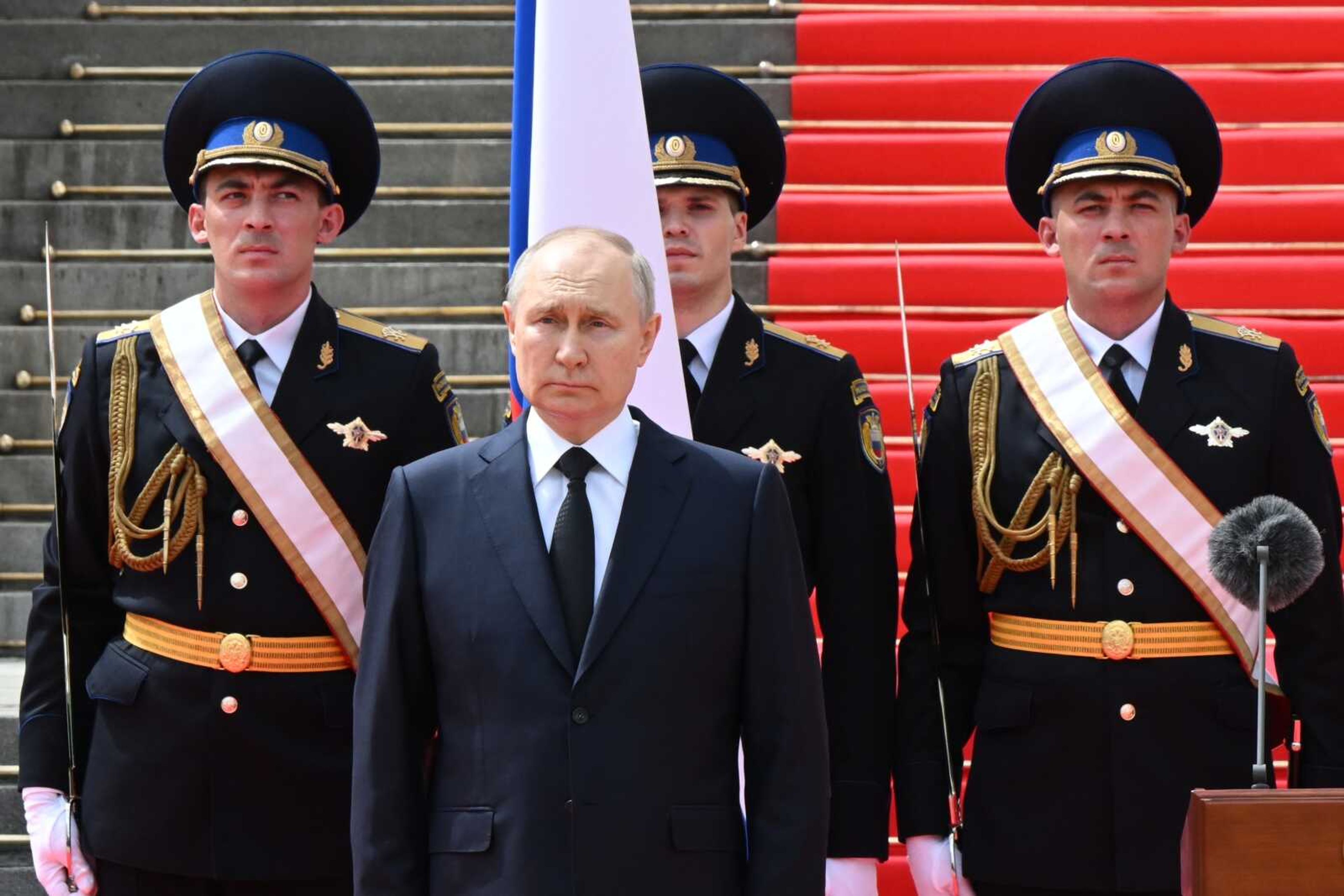 FILE - Russian President Vladimir Putin listens to the national anthem prior to delivering a speech to the units of the Russian Defense Ministry, the Russian National Guard (Rosgvardiya), the Russian Interior Ministry, the Russian Federal Security Service and the Russian Federal Guard Service, who ensured order and legality during the mutiny, at the Kremlin in Moscow, Russia, Tuesday, June 27, 2023. Russia's rebellious mercenary chief Yevgeny Prigozhin walked free from prosecution for his June 24 armed mutiny, and it's still unclear if anyone will face any charges in the brief uprising against the military or for the deaths of the soldiers killed in it. (Sergei Guneyev, Sputnik, Kremlin Pool Photo via AP, File)