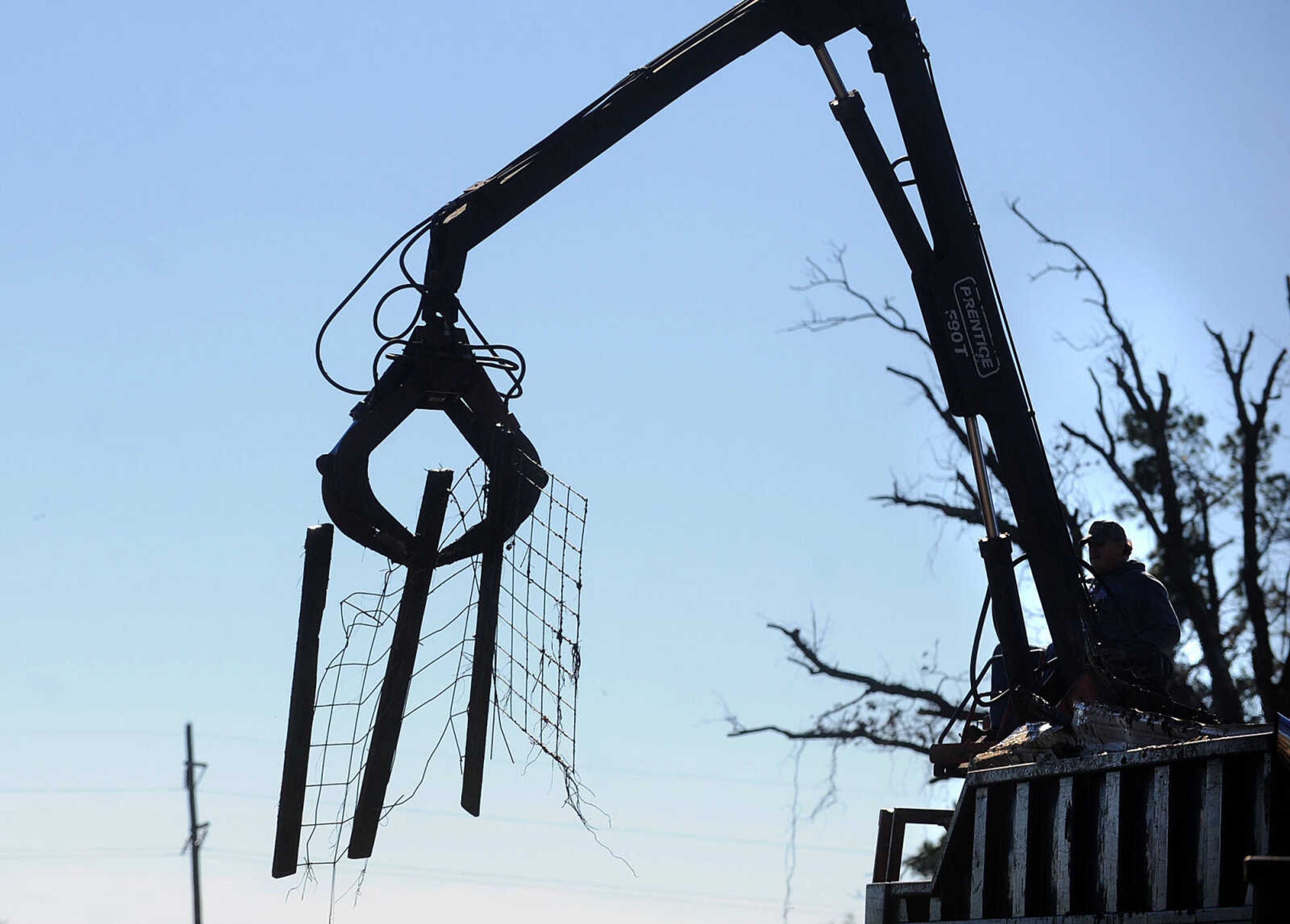 LAURA SIMON ~ lsimon@semissourian.com

Cleanup efforts from Sunday's storm are underway at Vince Draper's cattle farm, Monday, Nov. 18, 2013, southeast of Morley, Mo.