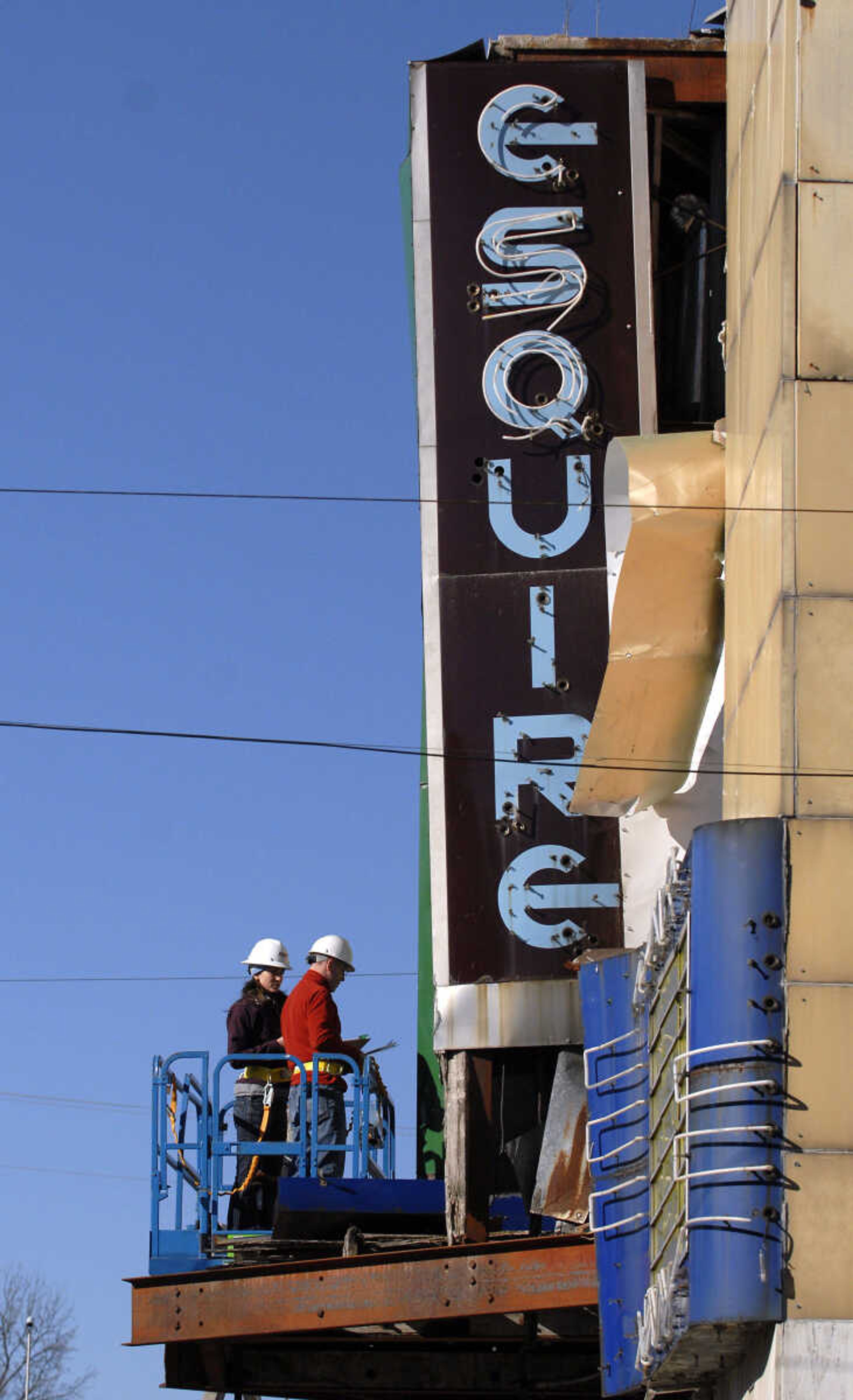 KRISTIN EBERTS ~ keberts@semissourian.com

Dennis Hyland, right, and Farrah Katzer, of Kiku Obata & Company, work to take measurements of the front facade of the Esquire Theater building on Friday, Jan. 6, 2012, in Cape Girardeau. Renovation work on the Esquire Theater continues as workers from Kiku Obata & Company and Penzel Construction complete field verification work and take measurements necessary for the design plans.