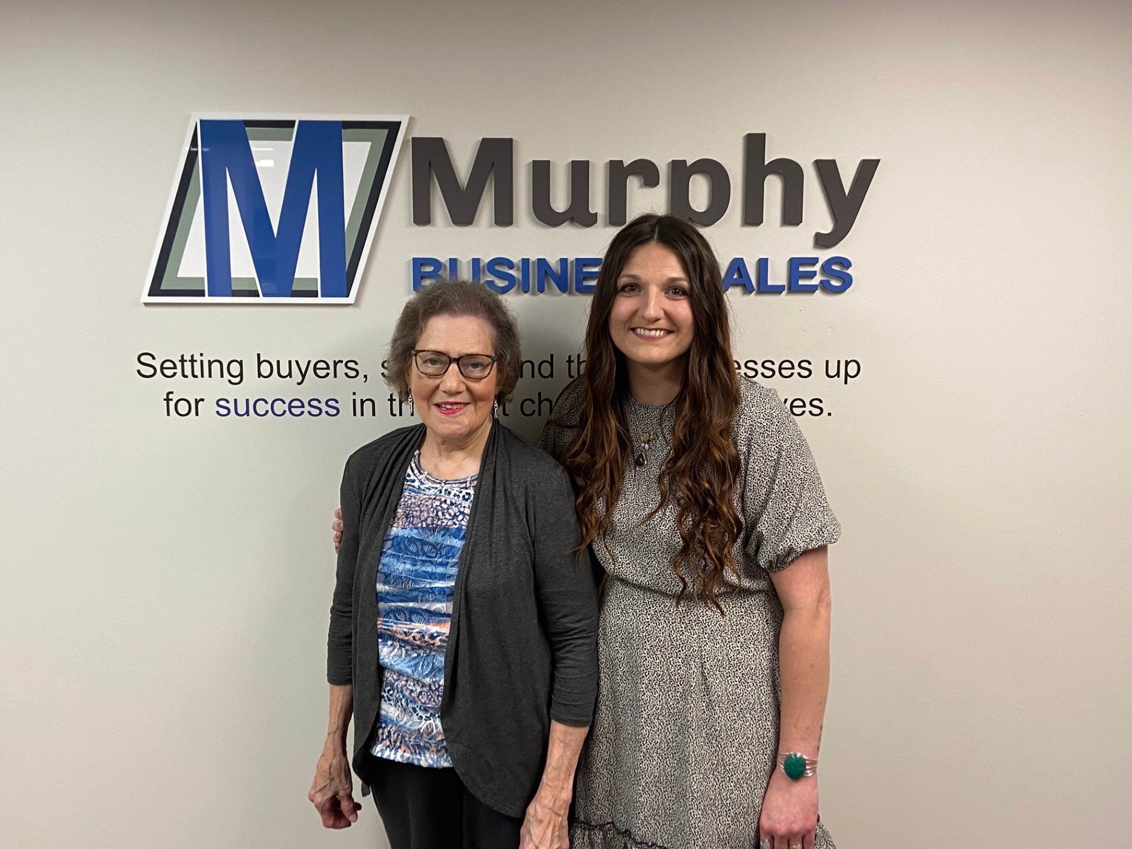 Margaret Cox, left, sold her Cox and Associates accounting services business to longtime employee Heather Collins, while Cox continues to work at the business.