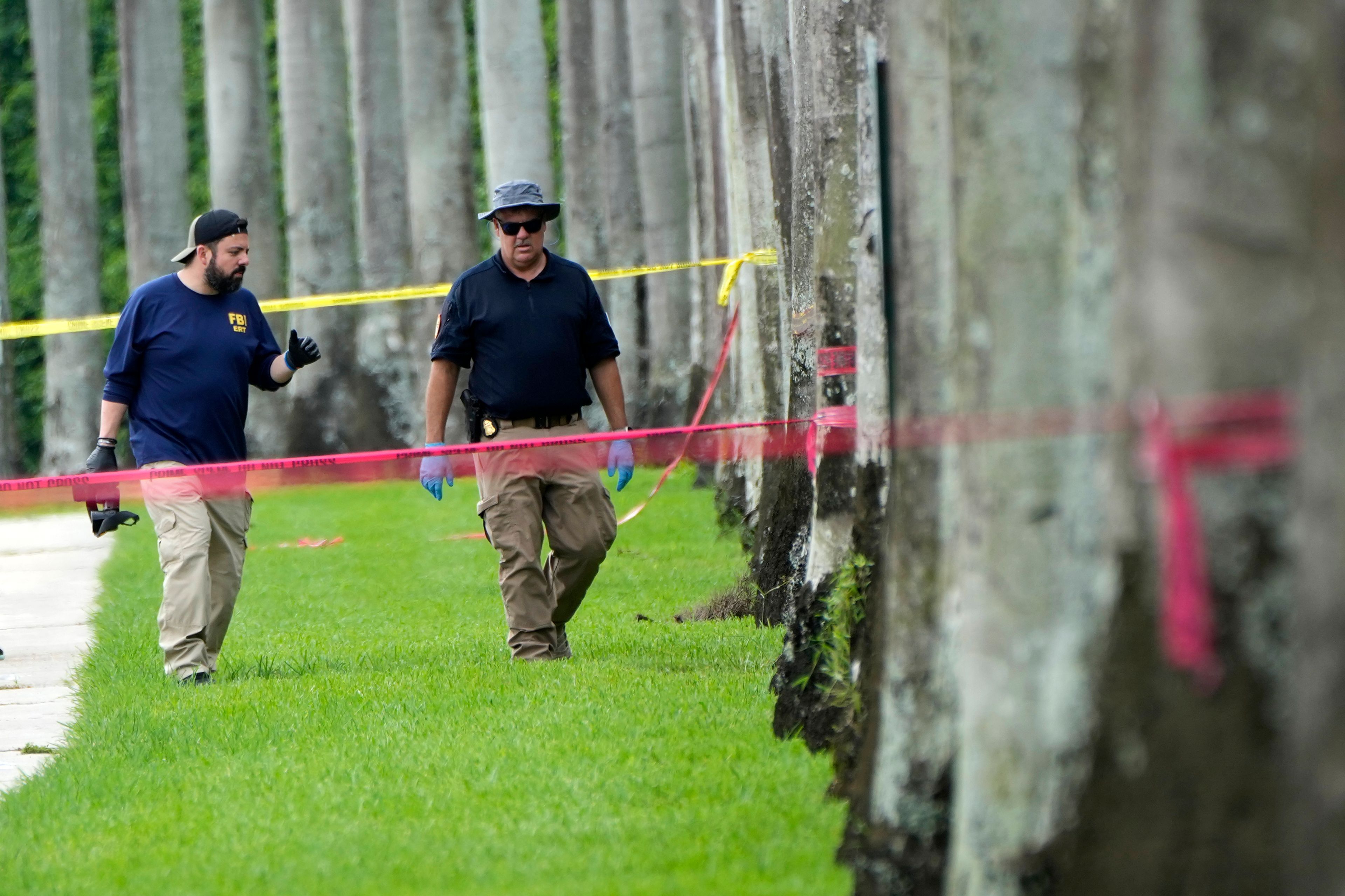 Law enforcement officials work outside of the Trump International Golf Club after the apparent assassination attempt of Republican presidential nominee and former President Donald Trump Monday, Sept. 16, 2024, in West Palm Beach, Fla. (AP Photo/Lynne Sladky)