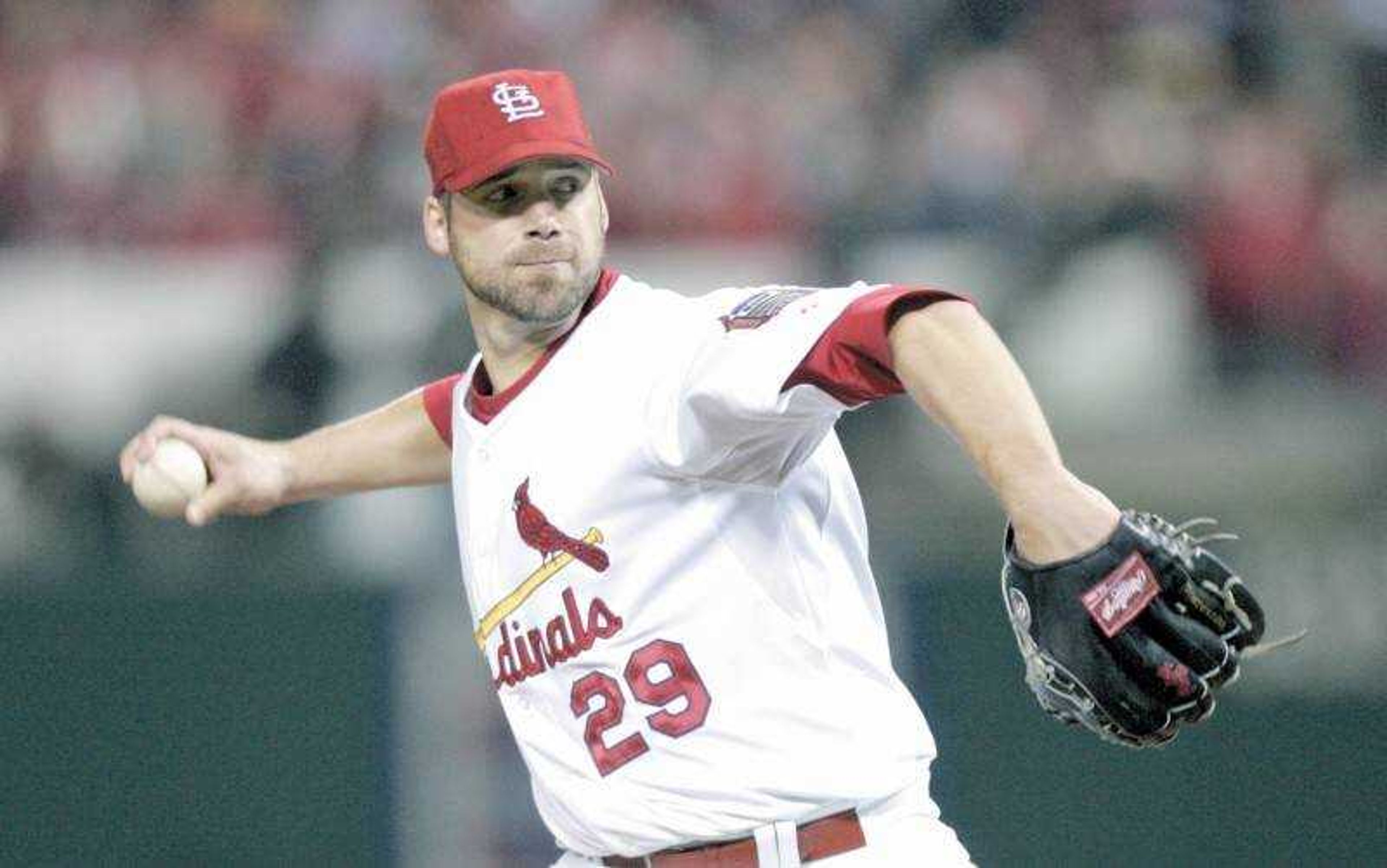 Cardinals starter Chris Carpenter delivered a pitch in the first inning Tuesday against the Tigers in Game 3 of the World Series at Busch Stadium. The reigning National League Cy Young winner pitched eight shutout innings, allowing three hits. (Associated Press)