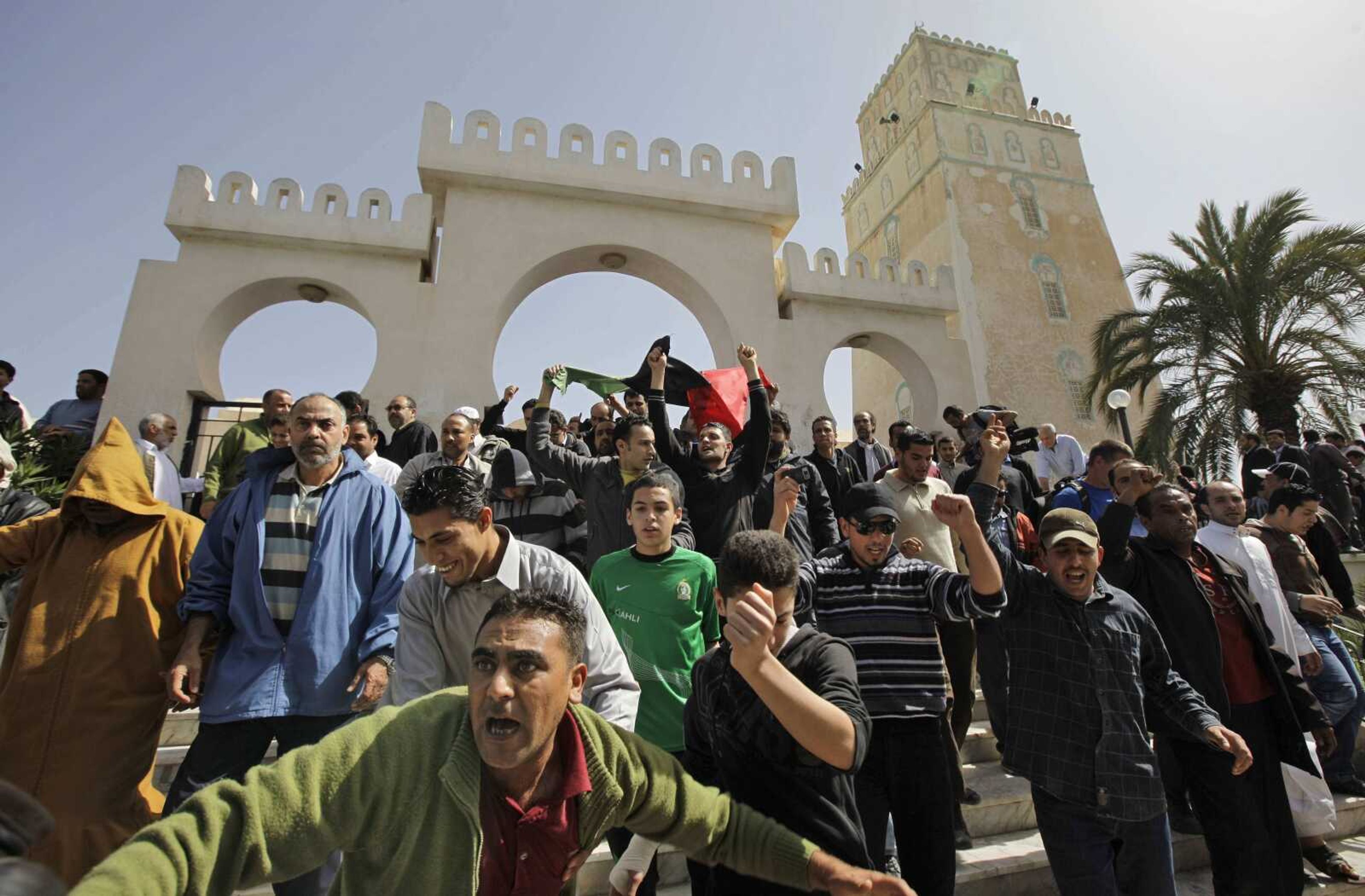 Anti-Gadhafi protesters leave the Muradagha mosque to demonstrate Friday after prayers in the Tajoura district of eastern Tripoli, Libya. (Ben Curtis ~ Associated Press)