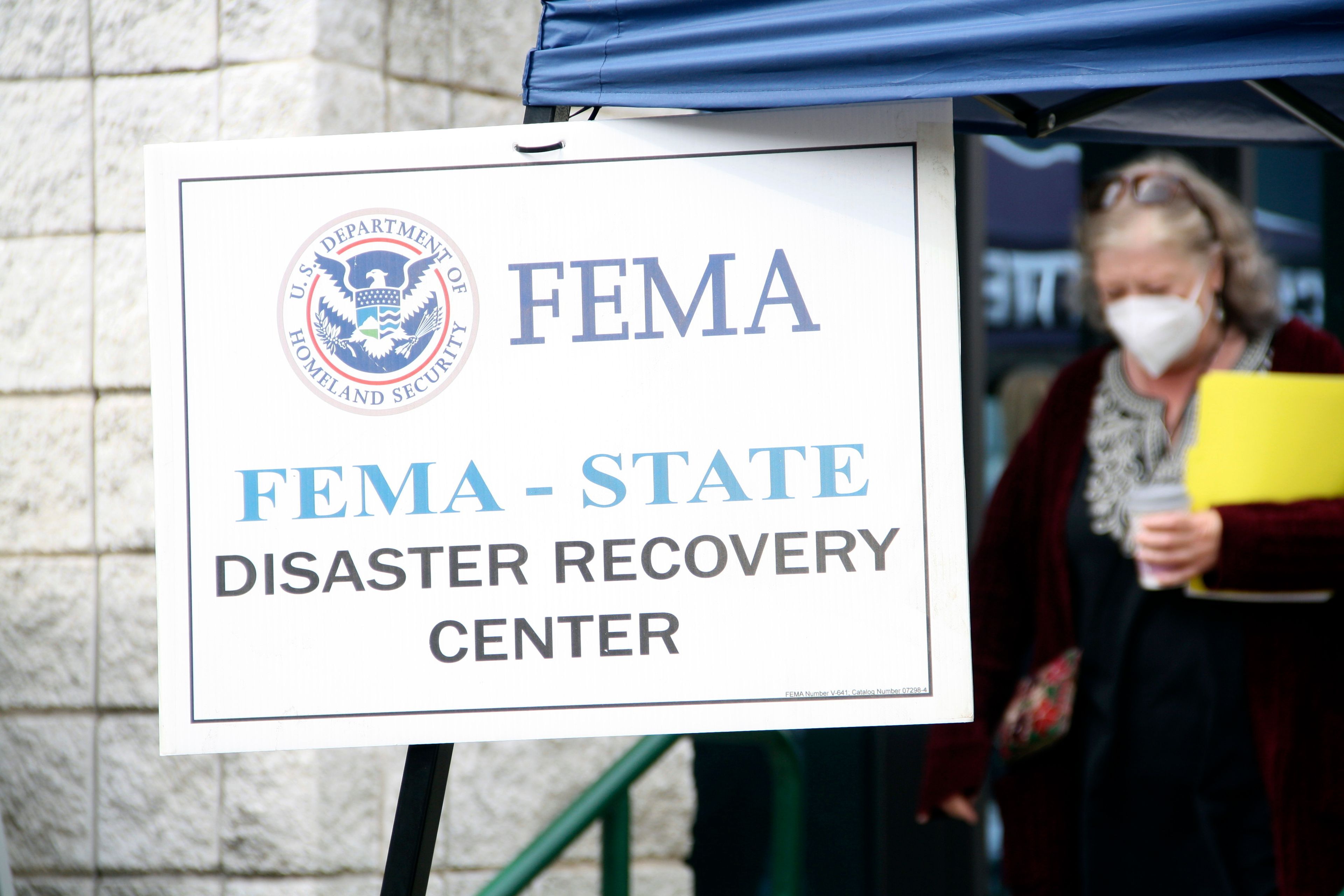 People gather at a FEMA Disaster Recovery Center at A.C. Reynolds High School in Asheville, N.C.,, Tuesday, Oct. 15, 2024. (AP Photo/Makiya Seminera)