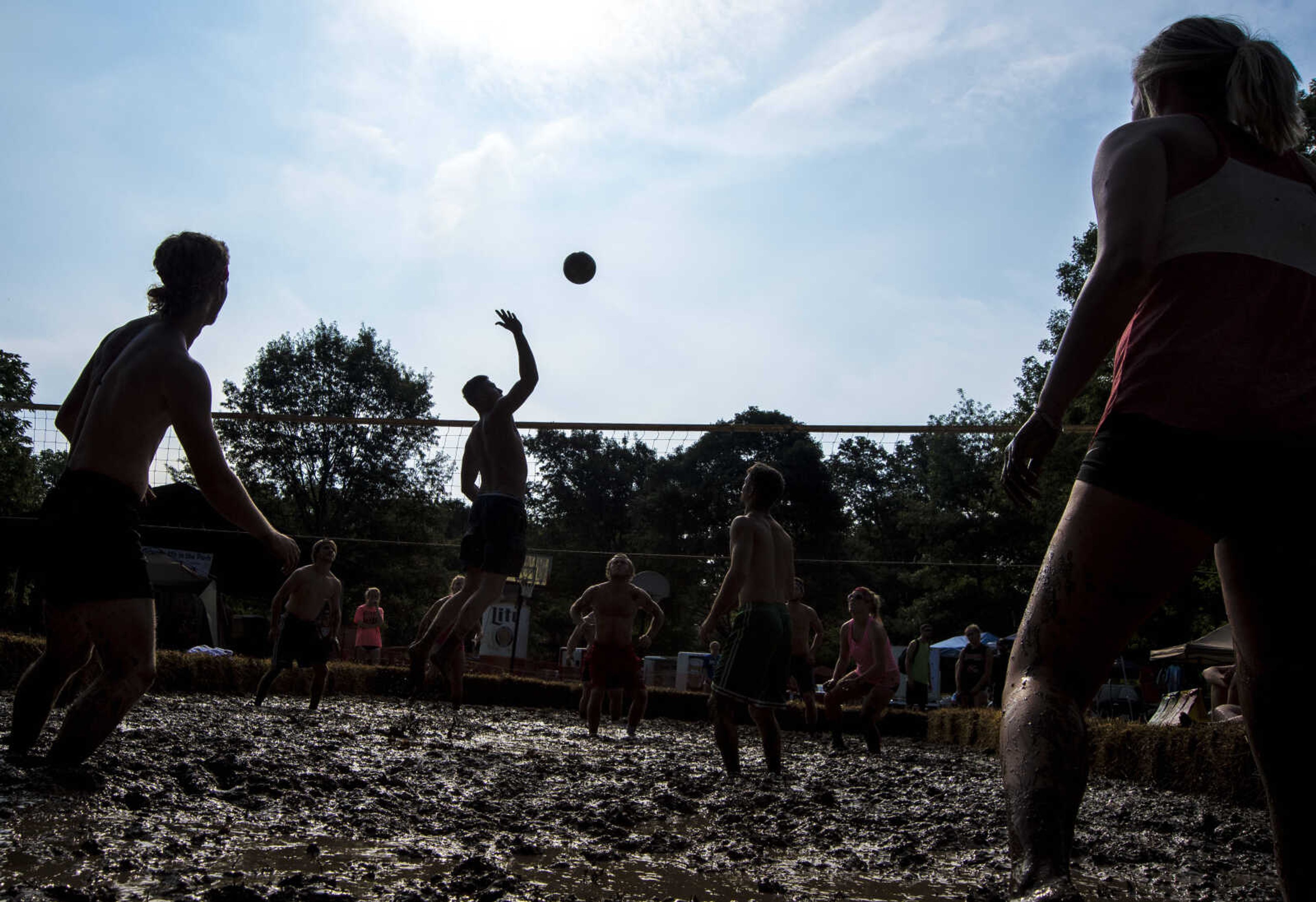 A person spikes the ball during mud volleyball for the Jackson Parks and Recreation's July 4th celebration Tuesday, July 4, 2017 in Jackson City Park.