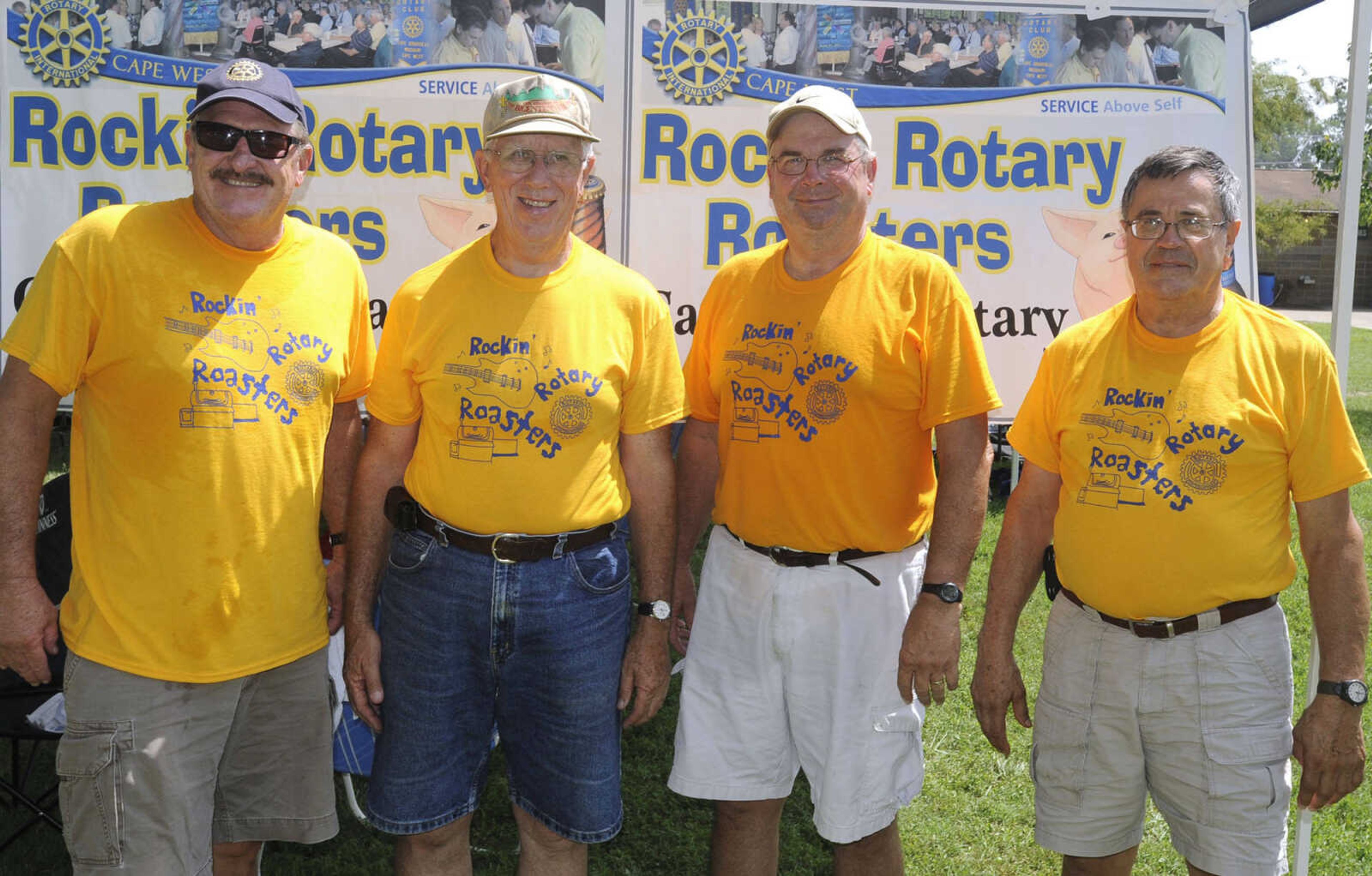 Skip Wrape, left, Ralph Maxton, Mike Radake and Jim Welk with the Rockin' Rotary Roasters of Cape West Rotary Club pose for a photo Saturday, Aug. 23, 2014 at the Cape BBQ Fest in Arena Park.