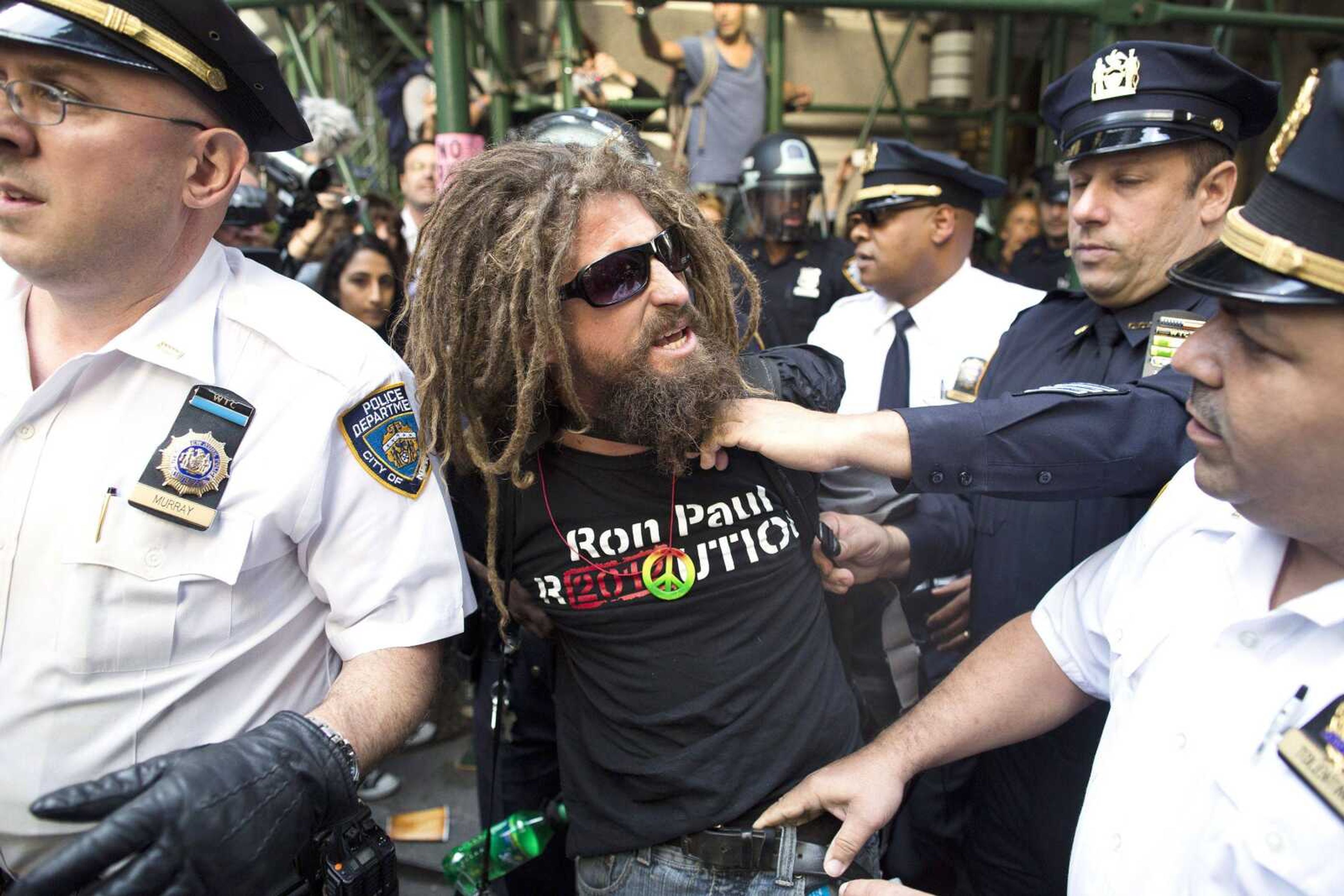 A.J. Redkey is arrested Monday during an Occupy Wall Street march in New York. (John Minchillo ~ Associated Press)